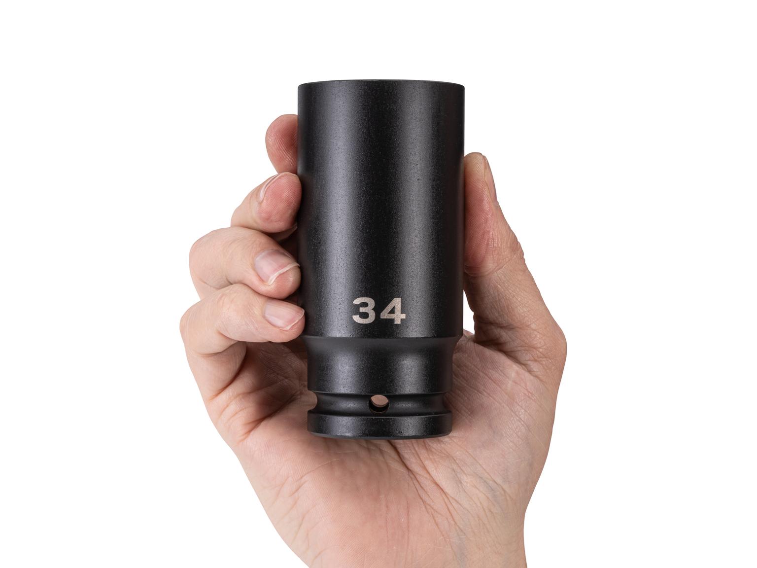 Person holding Tekton impact drive 6-point socket. Item #SID33134