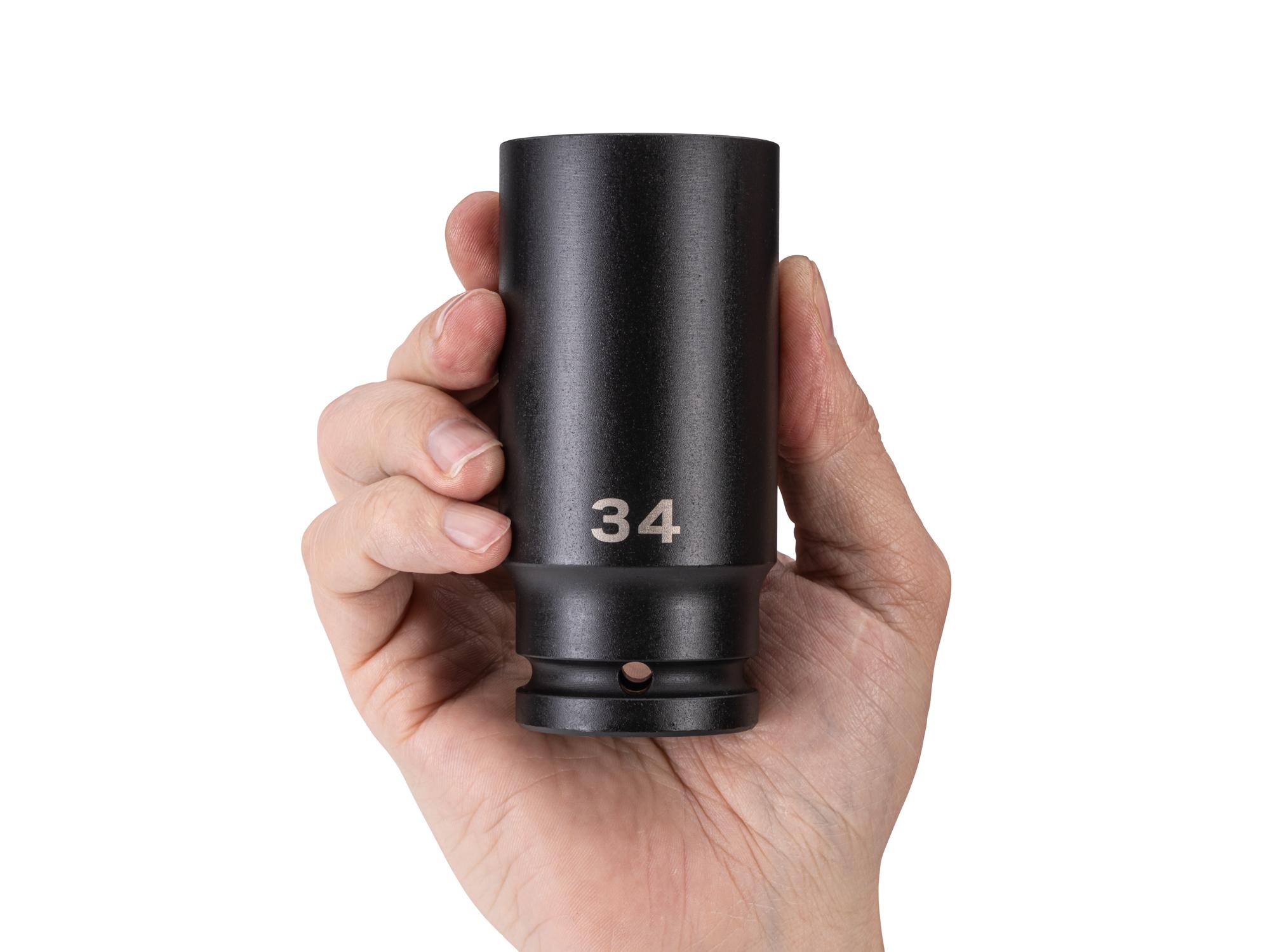 Person holding Tekton impact drive 6-point socket. Item #SID33134