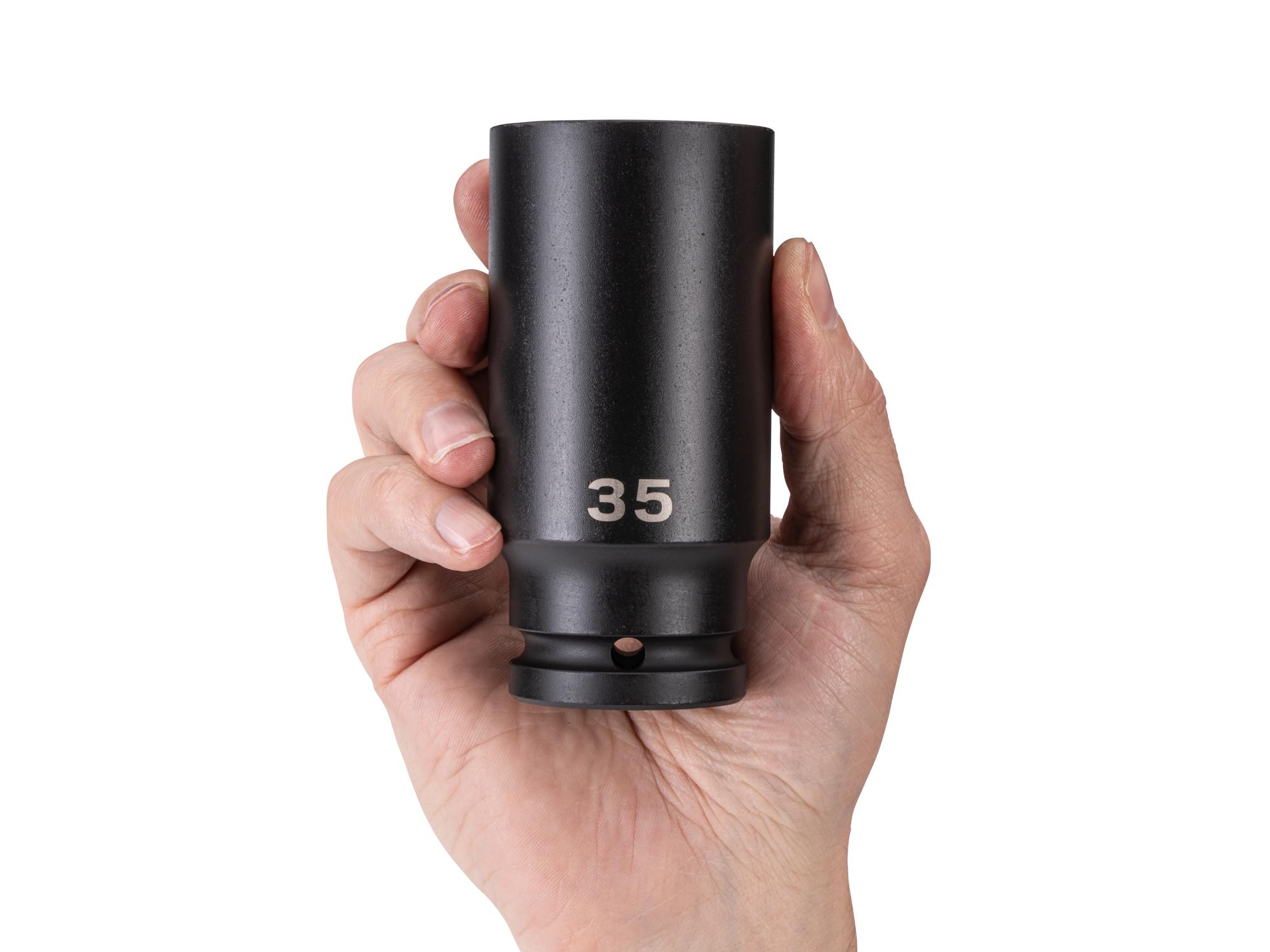Person holding Tekton impact drive 6-point socket. Item #SID33135