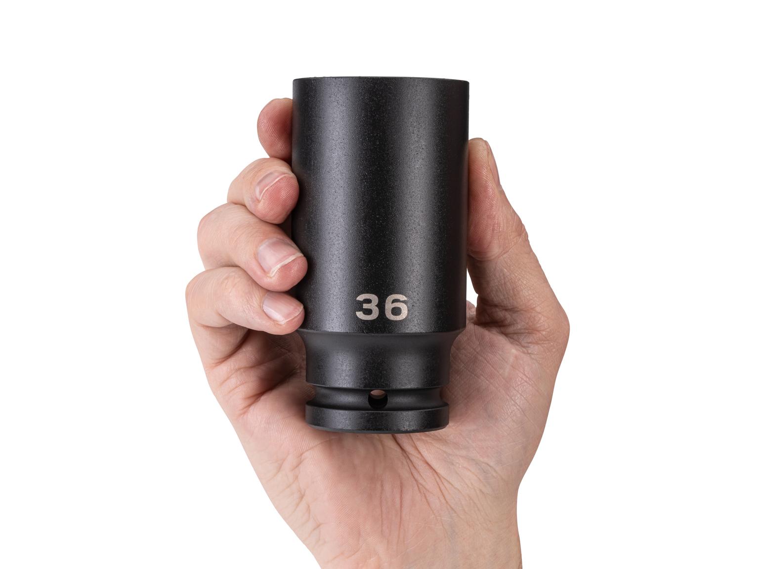 Person holding Tekton impact drive 6-point socket. Item #SID33136