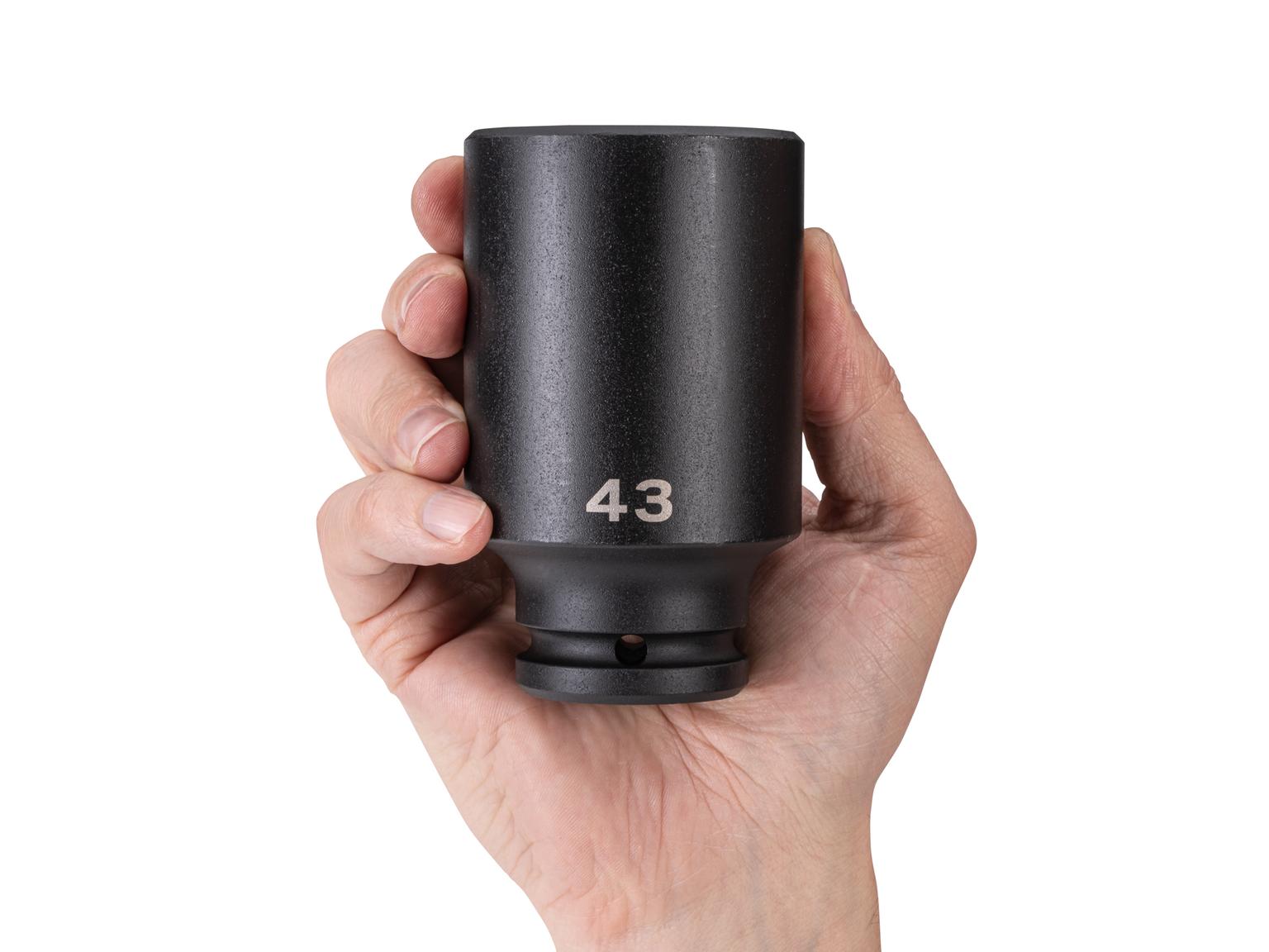 Person holding Tekton impact drive 6-point socket. Item #SID33143