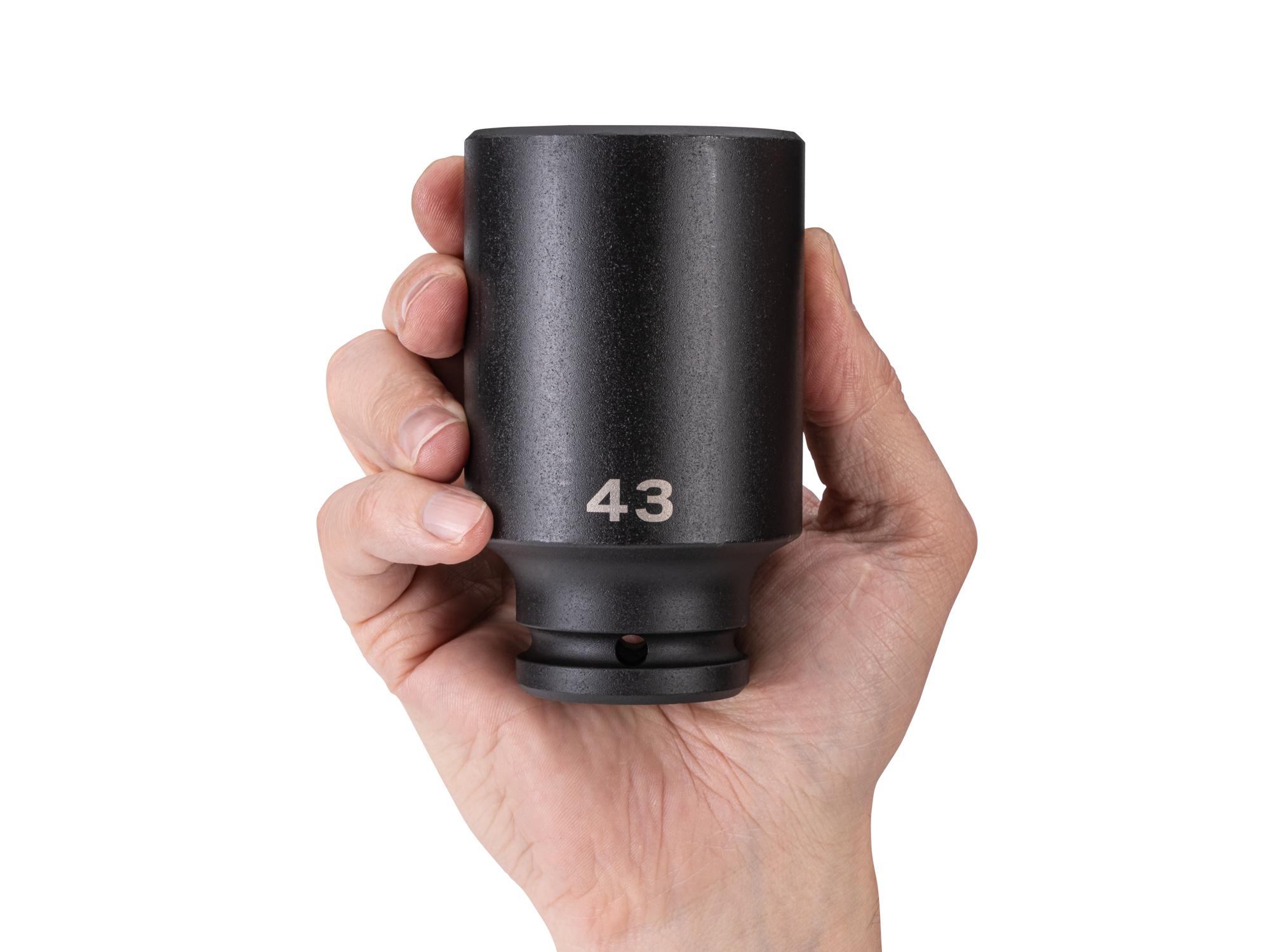 Person holding Tekton impact drive 6-point socket. Item #SID33143