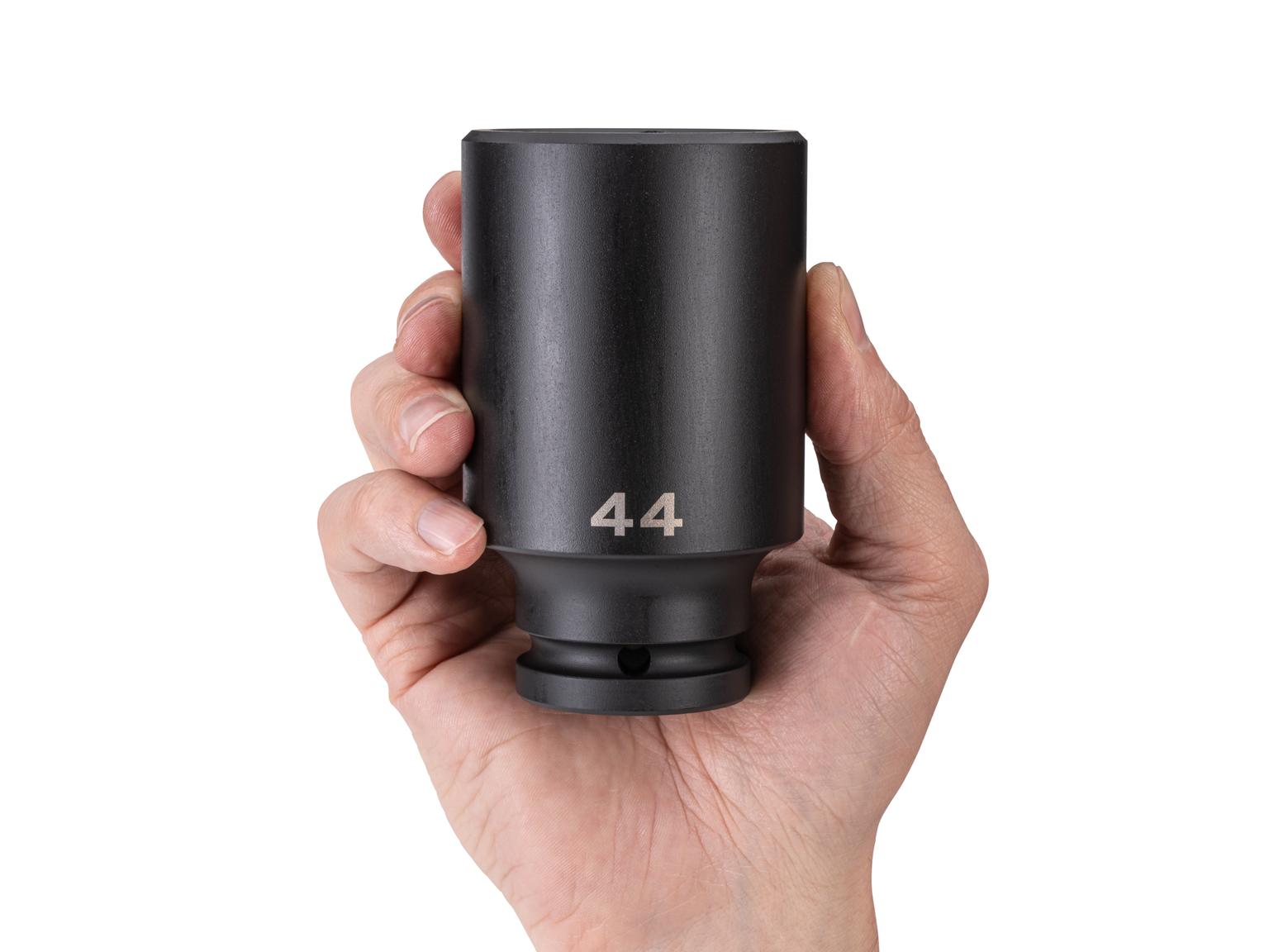 Person holding Tekton impact drive 6-point socket. Item #SID33144