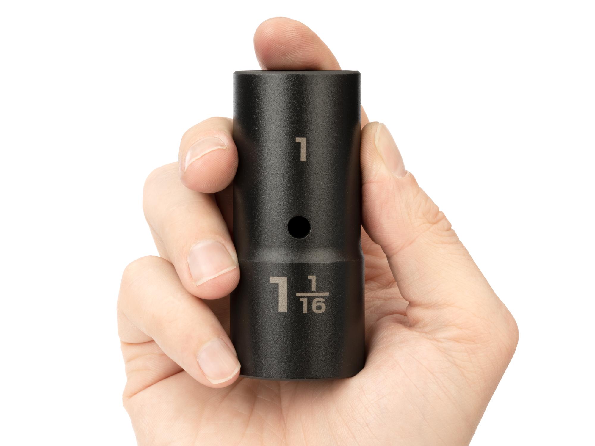 Person holding Tekton impact drive 6-point socket. Item #SIF21011