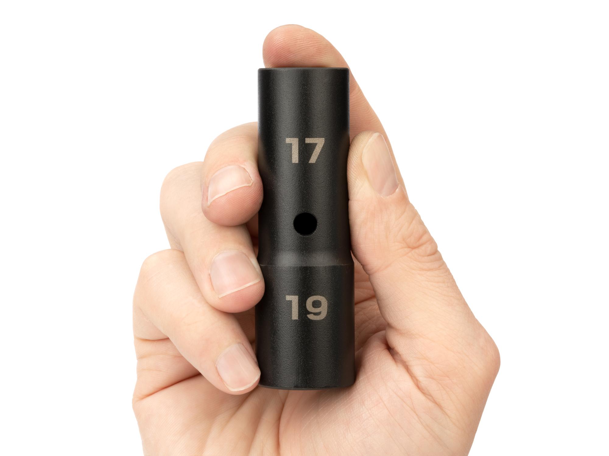 Person holding Tekton impact drive 6-point socket. Item #SIF21719