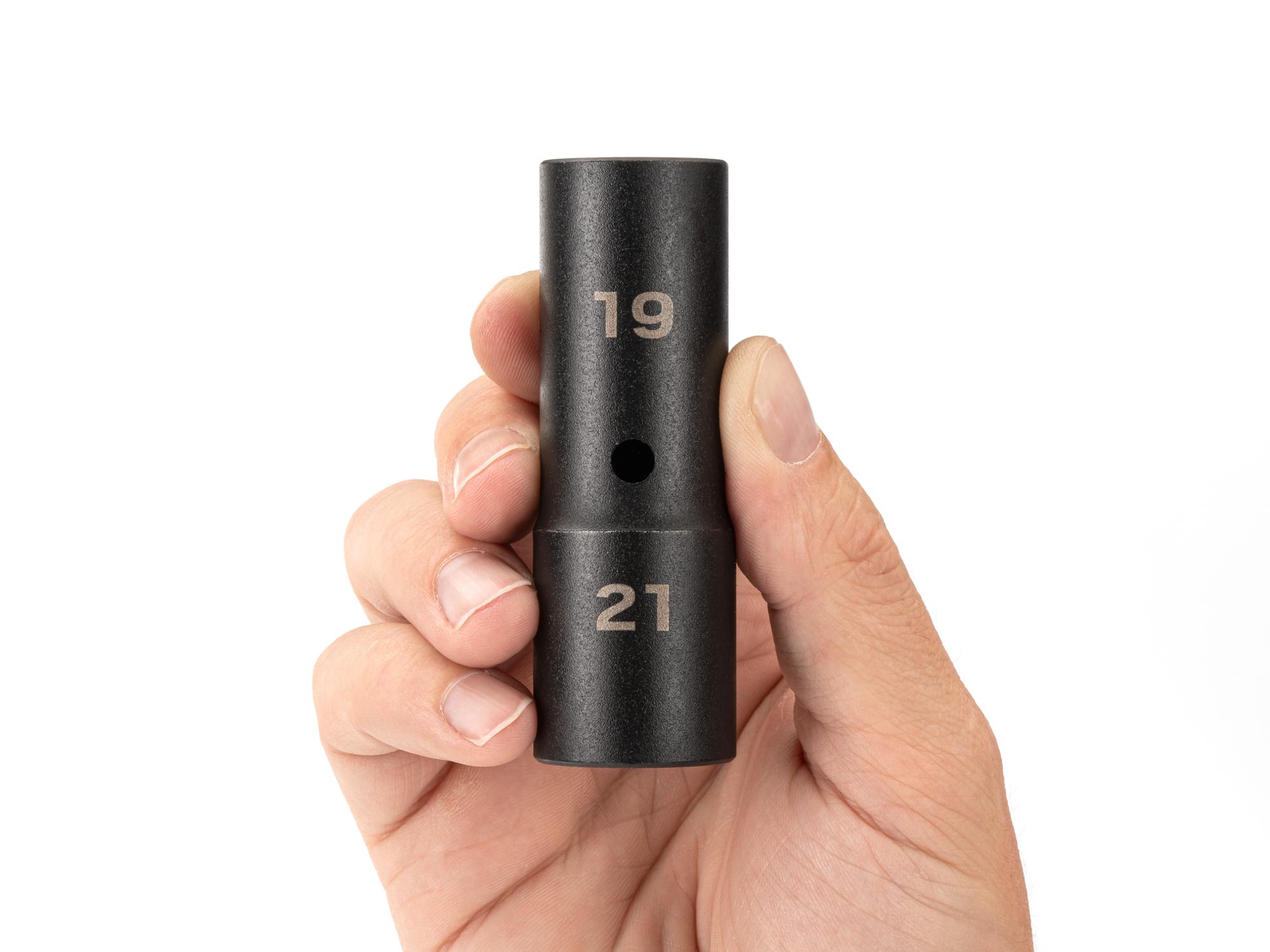 Person holding Tekton impact drive 6-point socket. Item #SIF21921