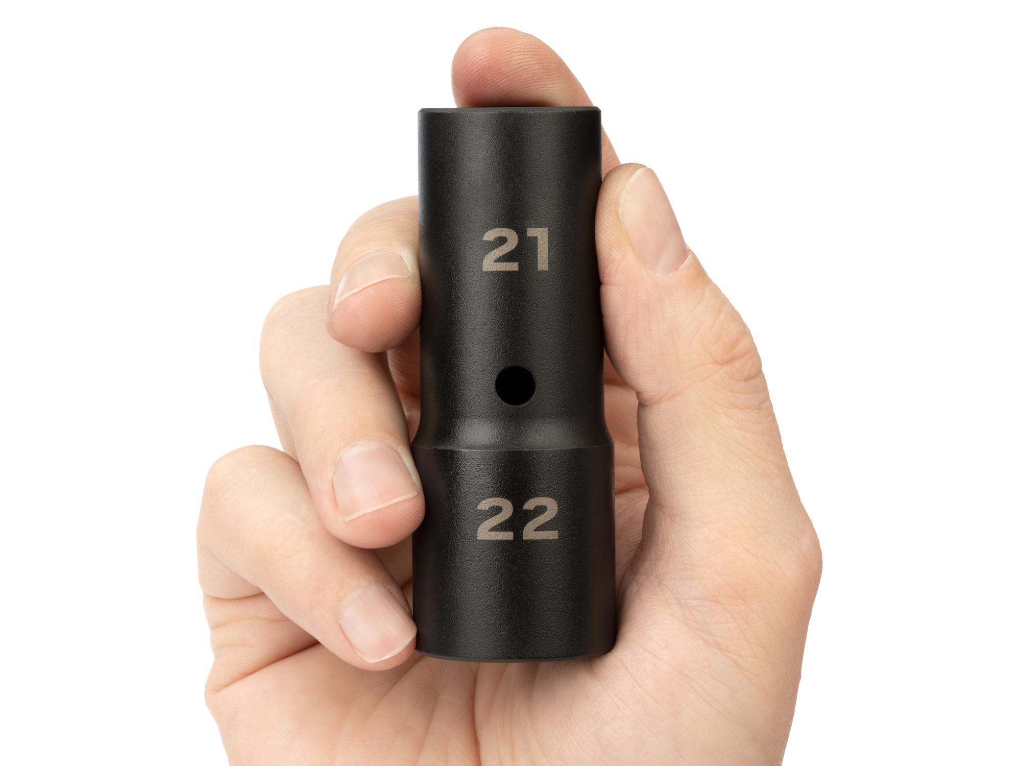 Person holding Tekton impact drive 6-point socket. Item #SIF22122
