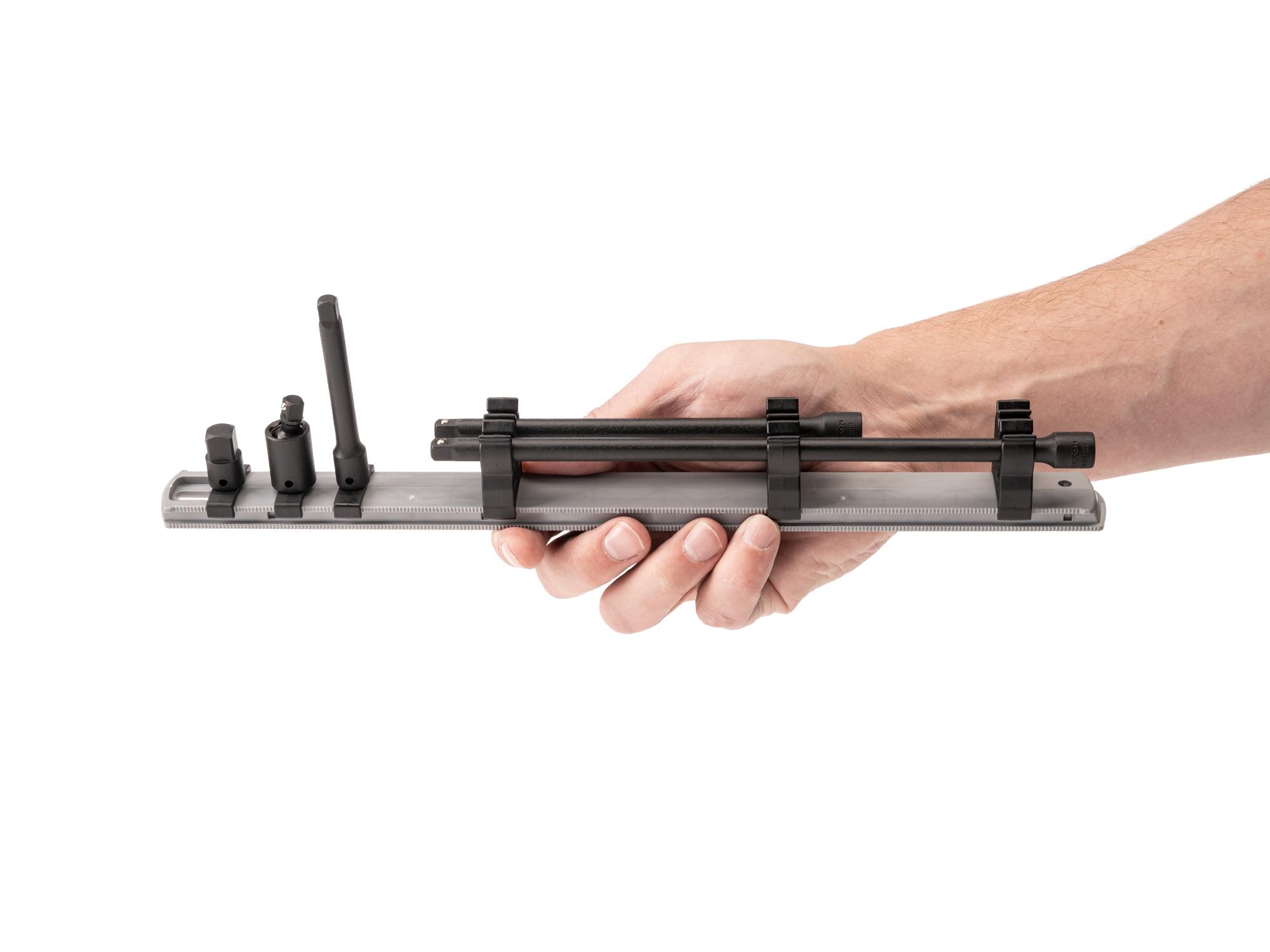 Person holding Tekton 13.1 impact drive accessory set. Item #SIA90101