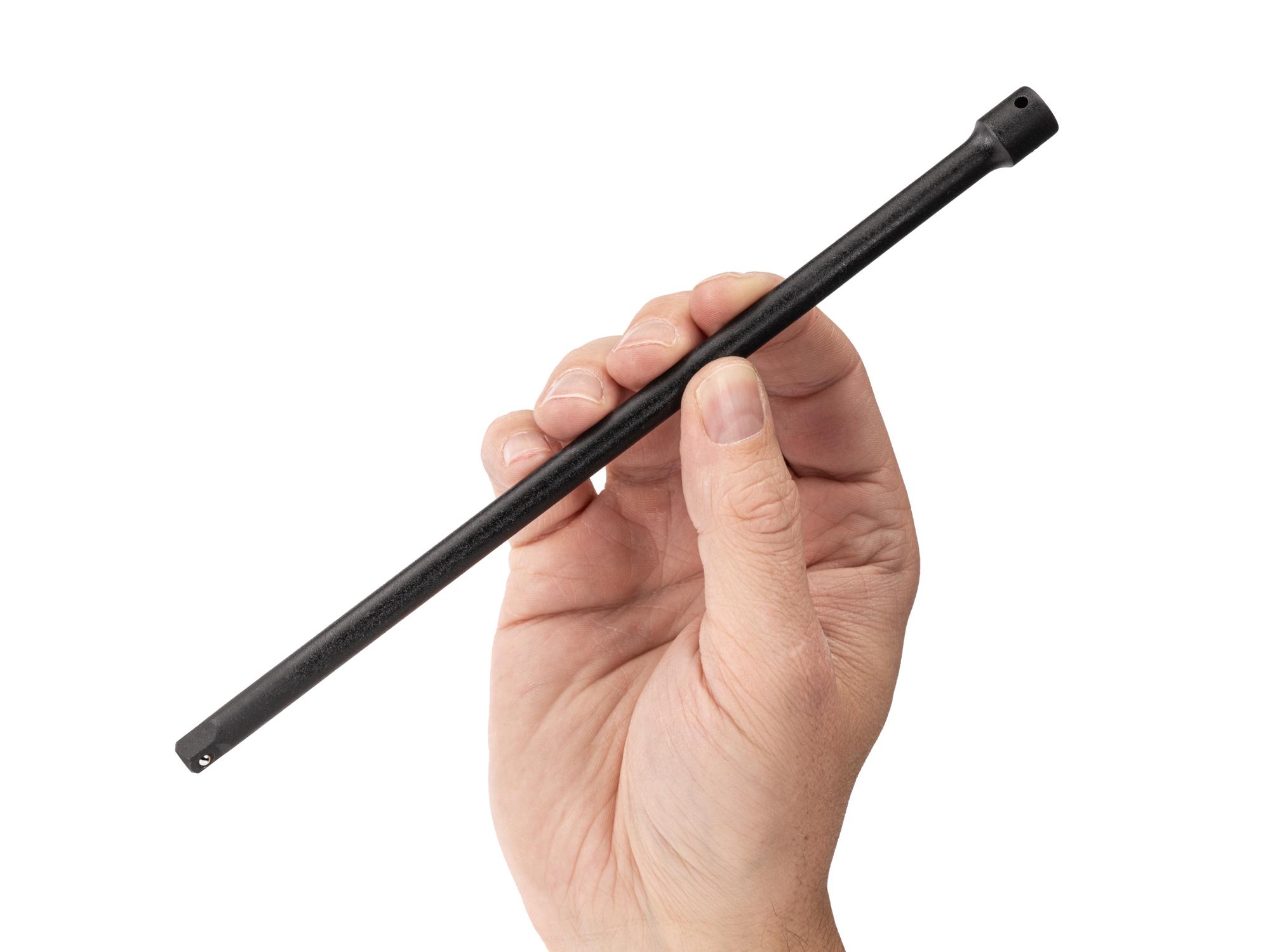 Person holding Tekton 9 inch impact drive accessory. Item #SIA01109