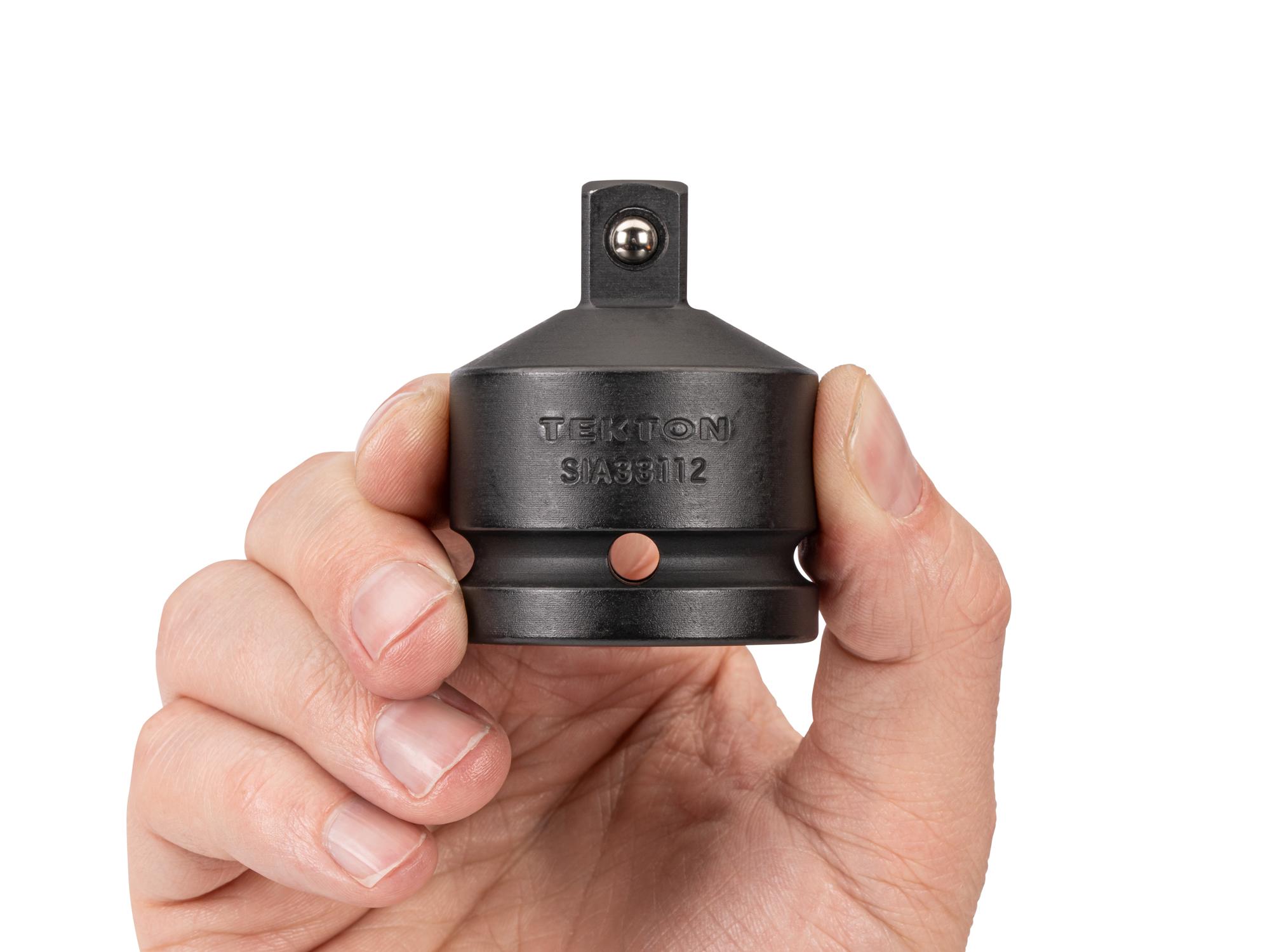Person holding Tekton impact drive accessory. Item #SIA33112