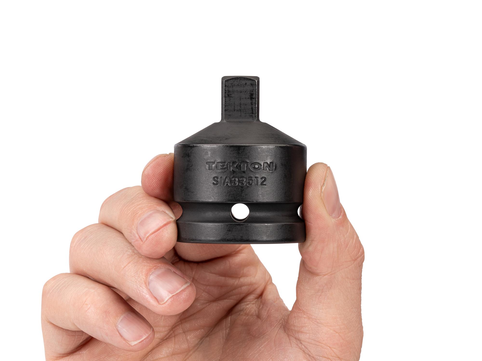 Person holding Tekton impact drive accessory. Item #SIA33512