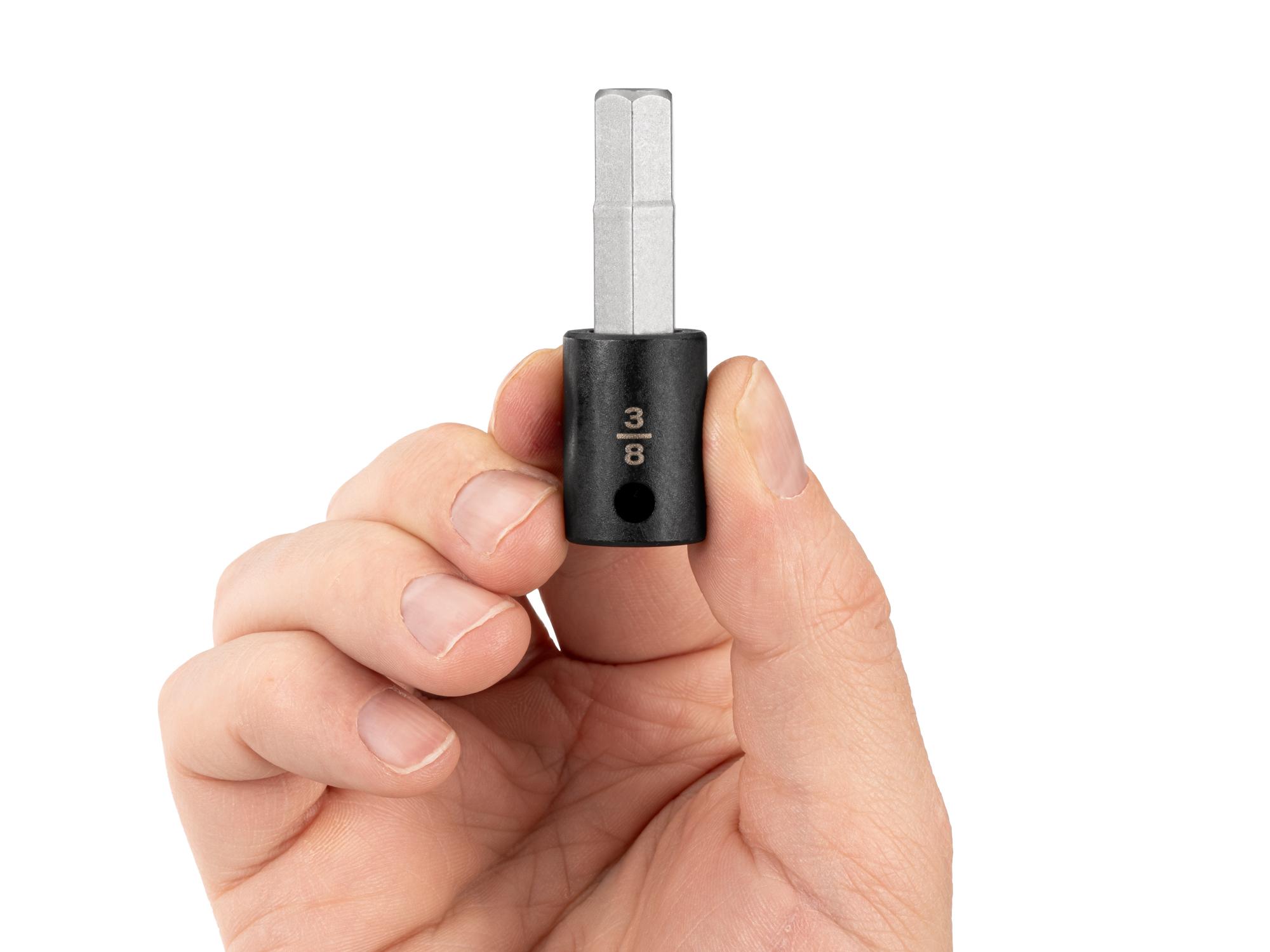 Person holding Tekton impact drive bit socket. Item #SIB12210