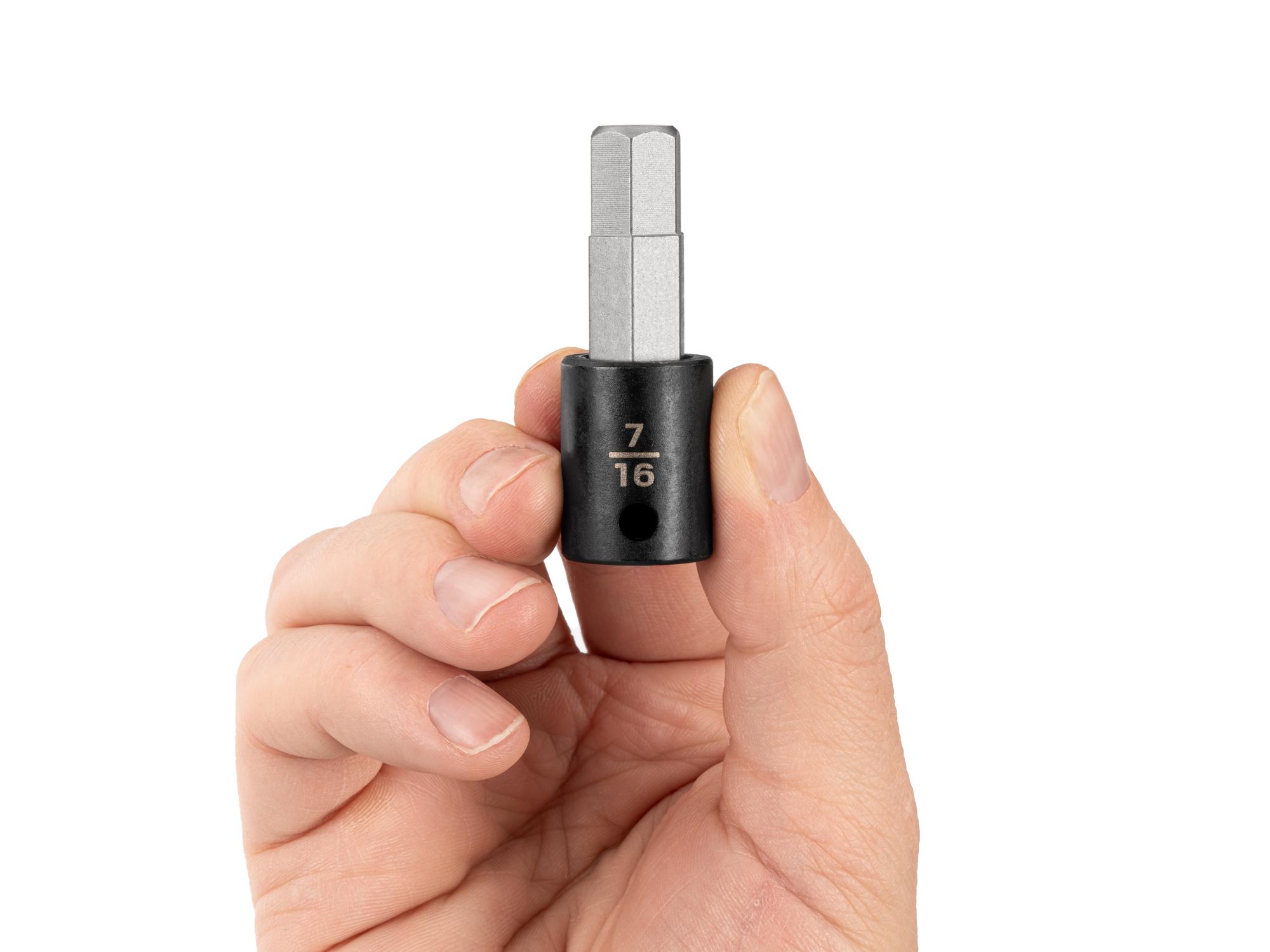 Person holding Tekton impact drive bit socket. Item #SIB12211
