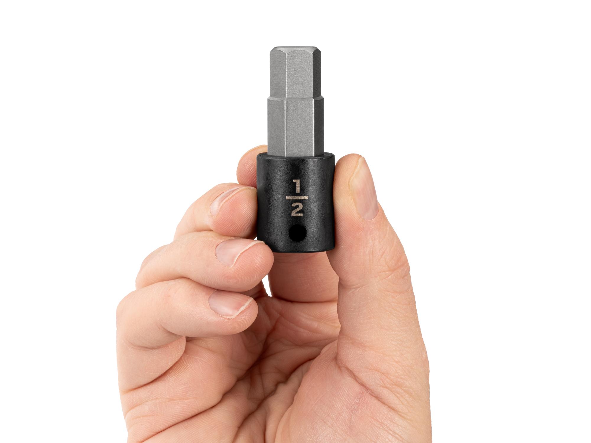 Person holding Tekton impact drive bit socket. Item #SIB12213