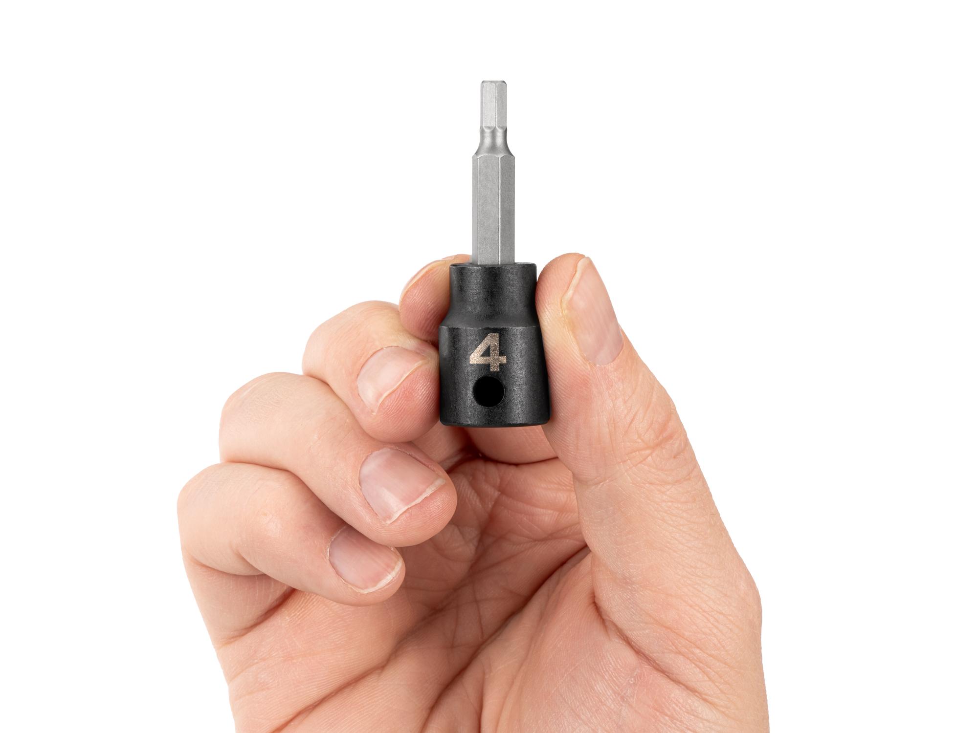 Person holding Tekton impact drive bit socket. Item #SIB13202