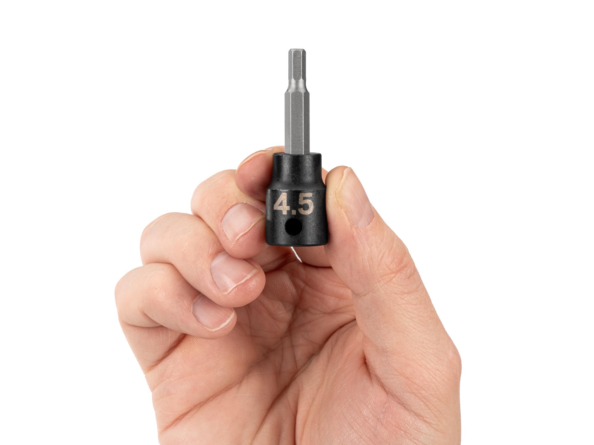 Person holding Tekton impact drive bit socket. Item #SIB13203