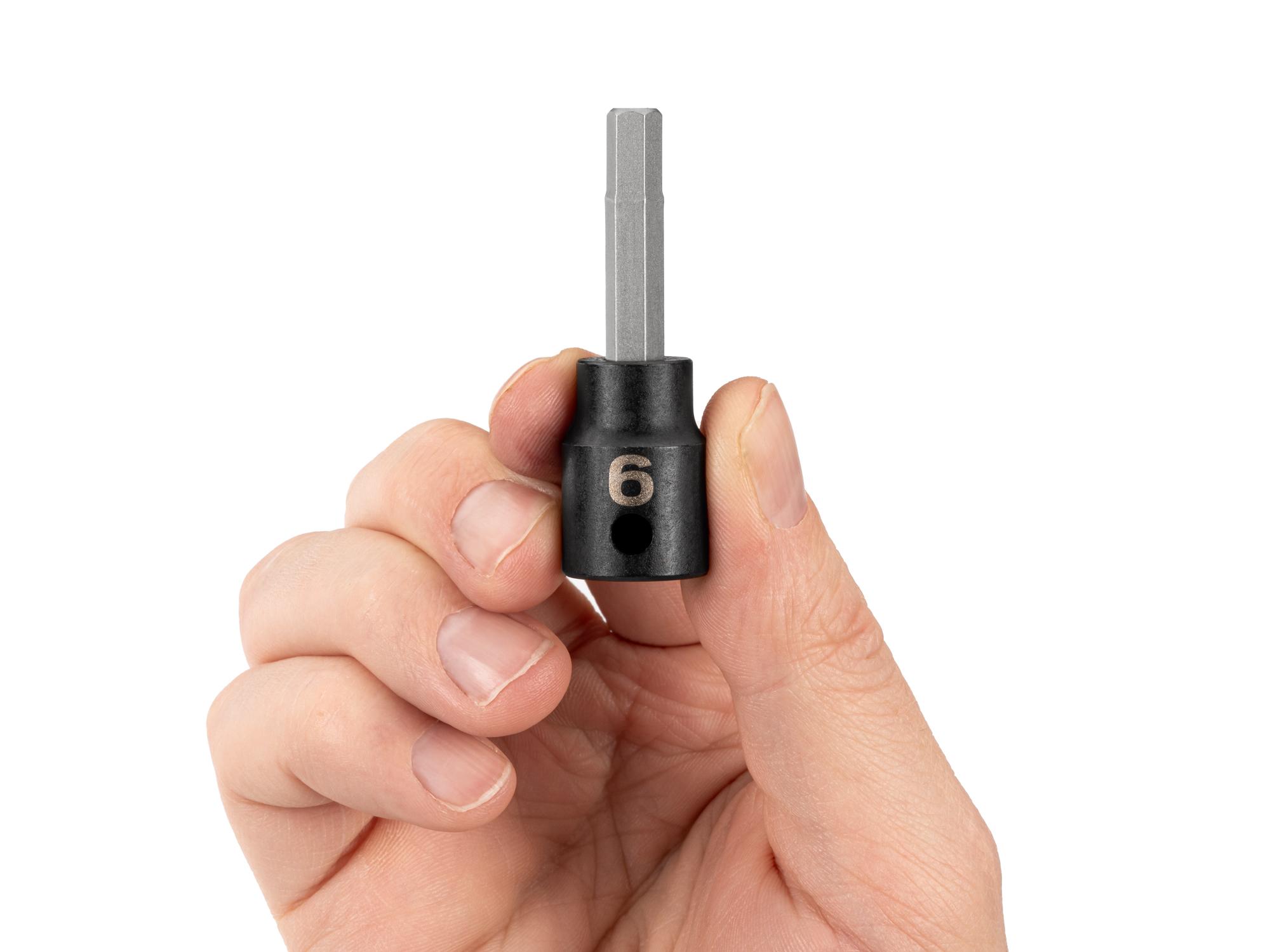 Person holding Tekton impact drive bit socket. Item #SIB13206