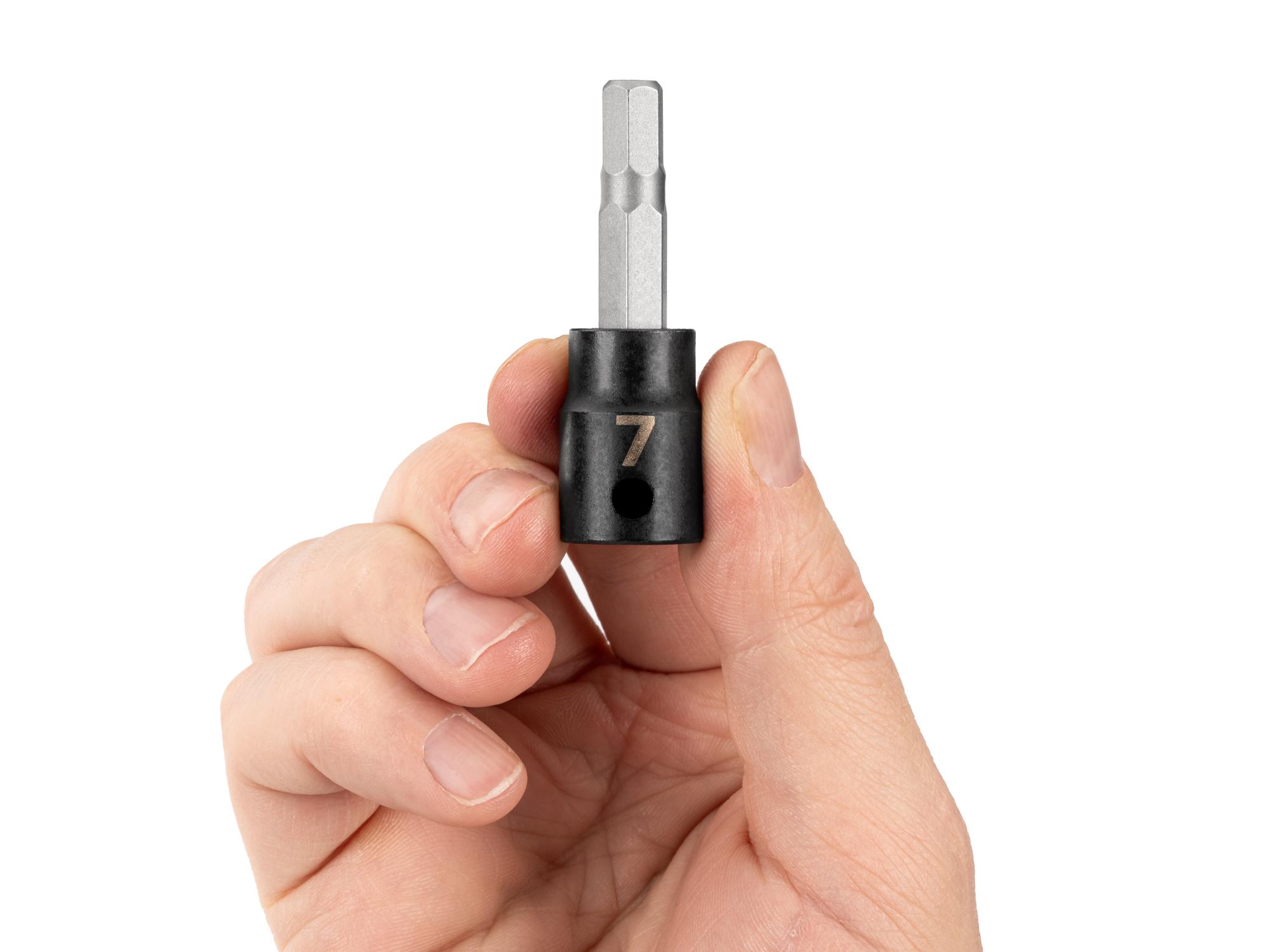 Person holding Tekton impact drive bit socket. Item #SIB13207