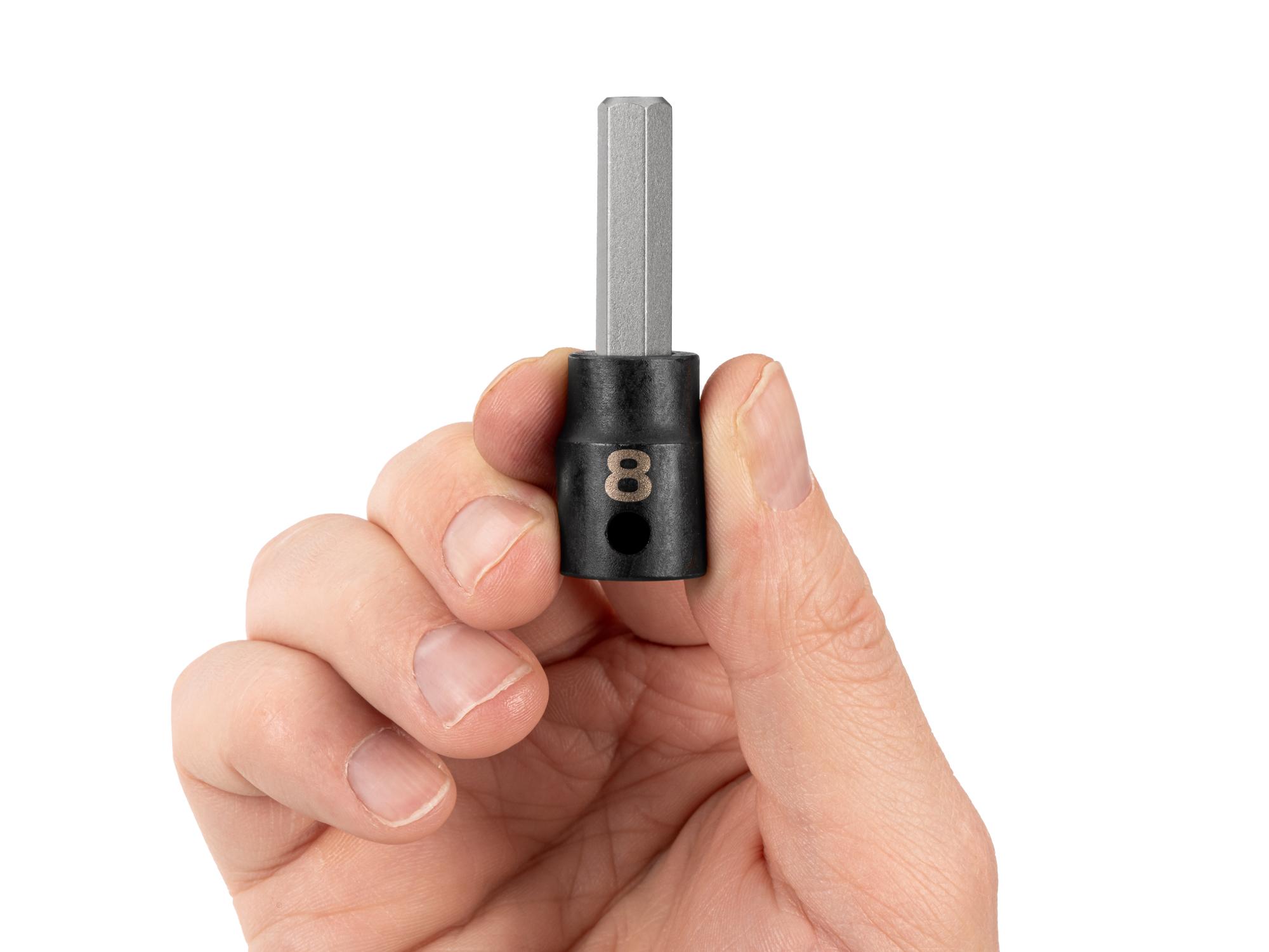 Person holding Tekton impact drive bit socket. Item #SIB13208