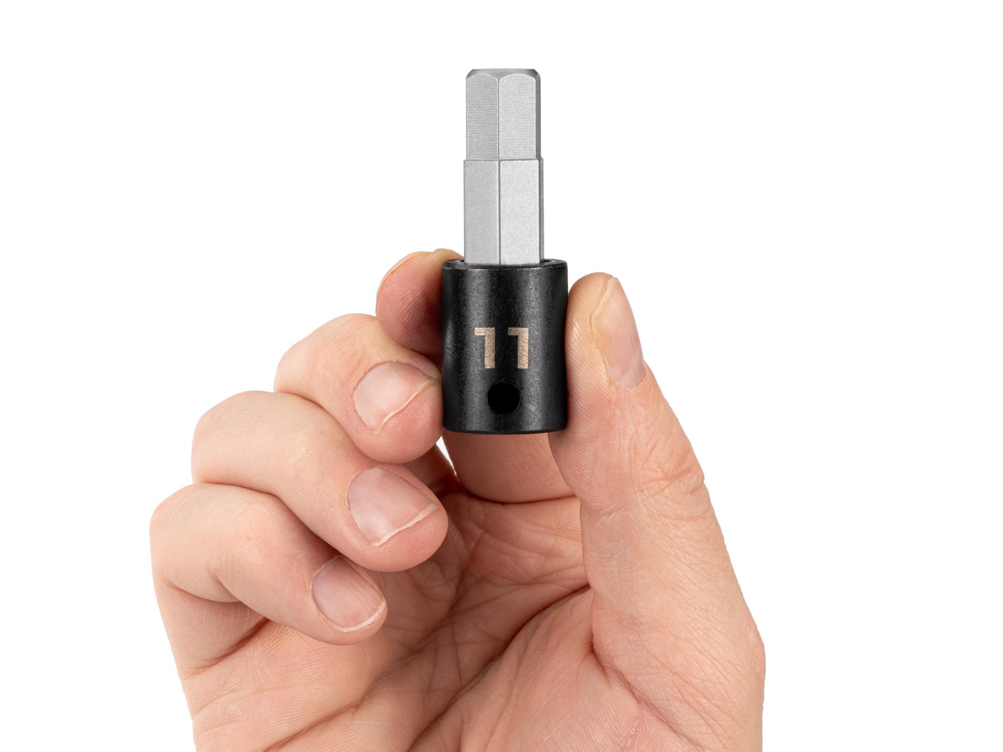Person holding Tekton impact drive bit socket. Item #SIB13211