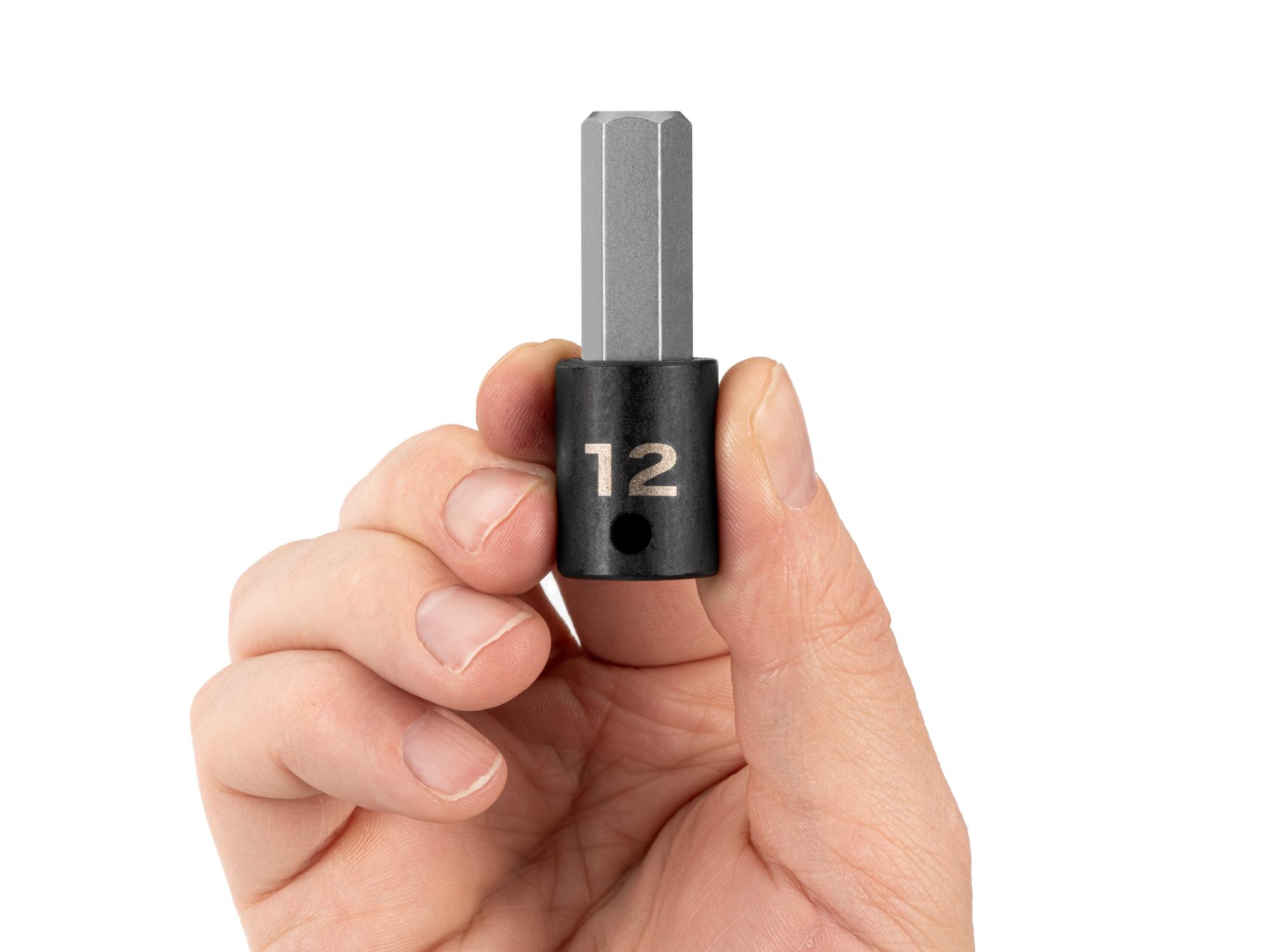 Person holding Tekton impact drive bit socket. Item #SIB13212