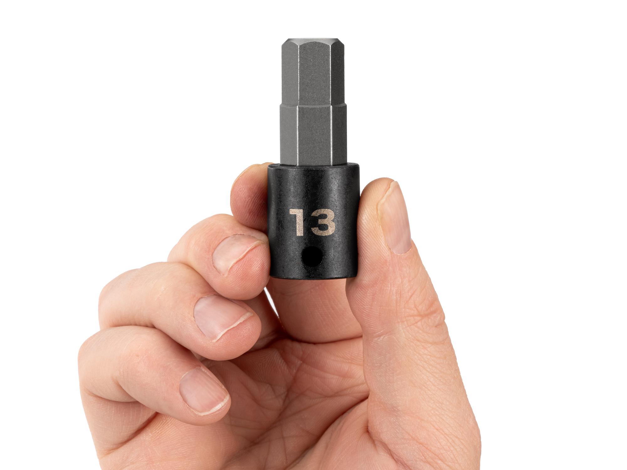 Person holding Tekton impact drive bit socket. Item #SIB13213