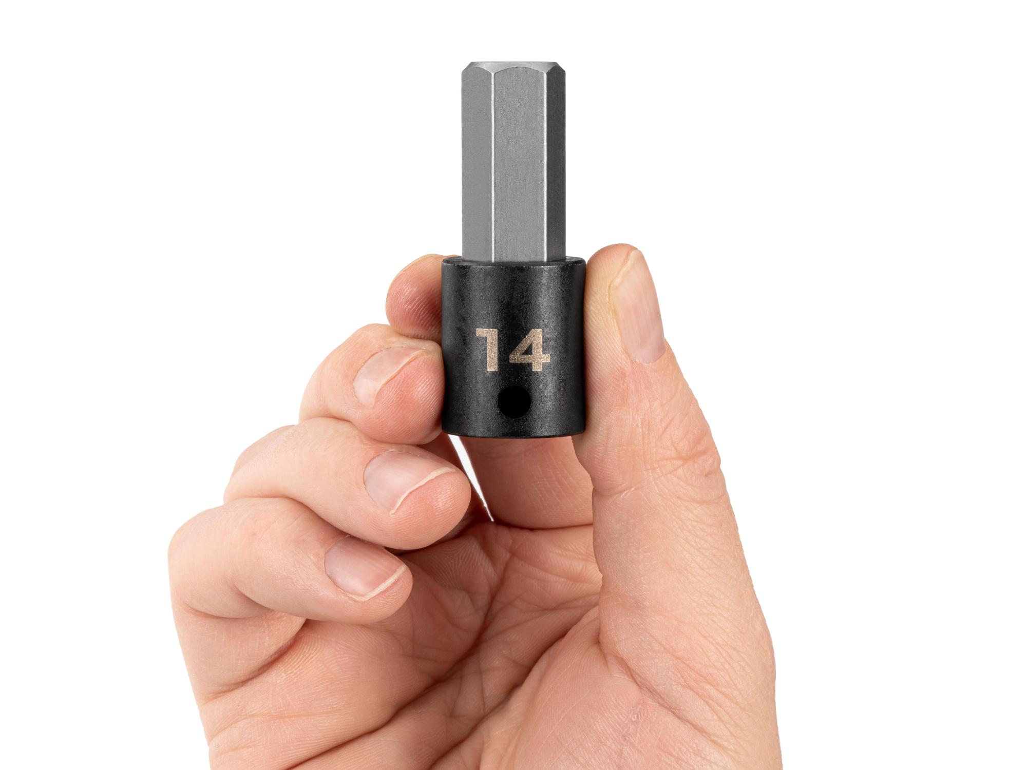 Person holding Tekton impact drive bit socket. Item #SIB13214