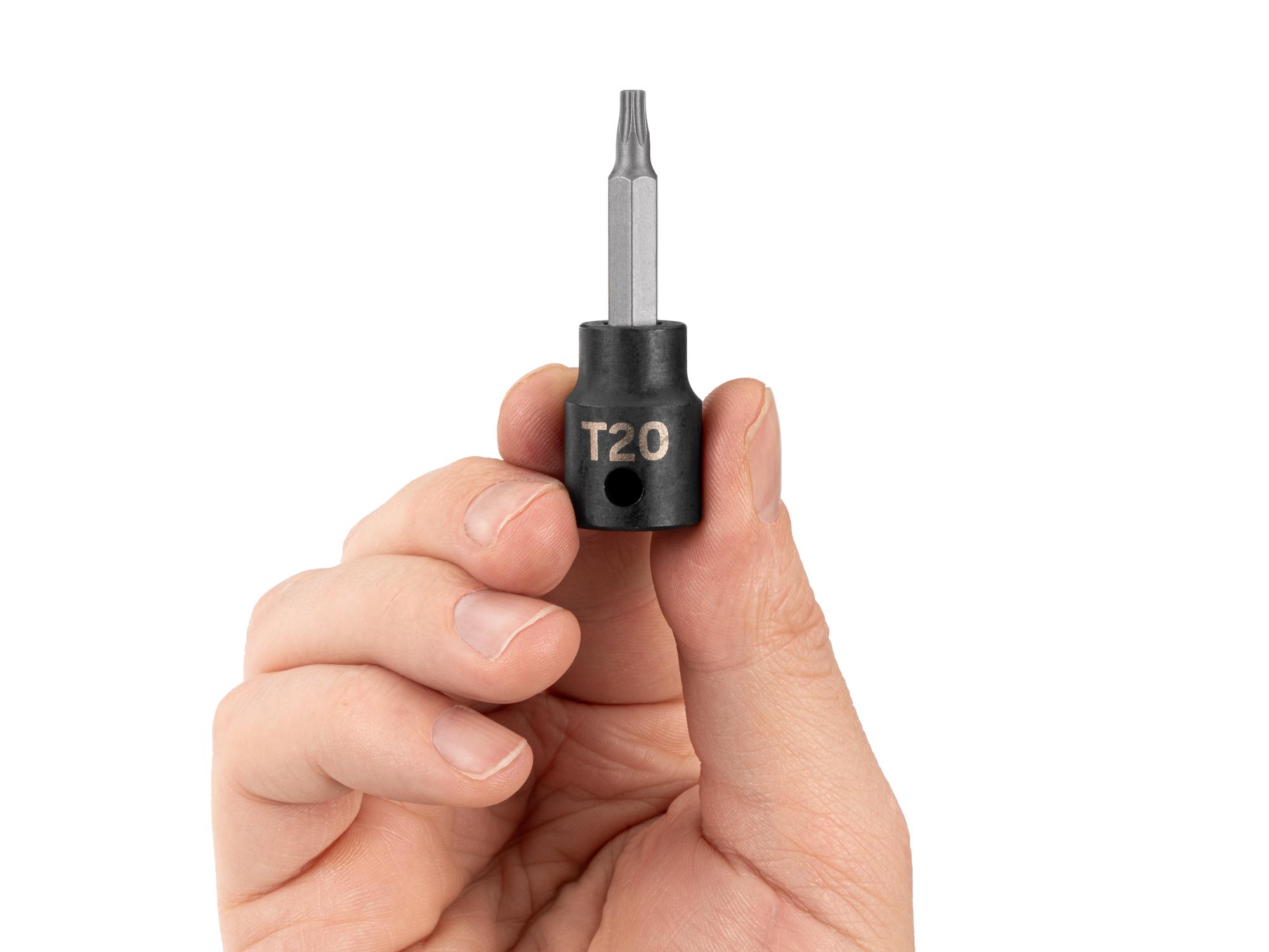 Person holding Tekton impact drive bit socket. Item #SIB14220
