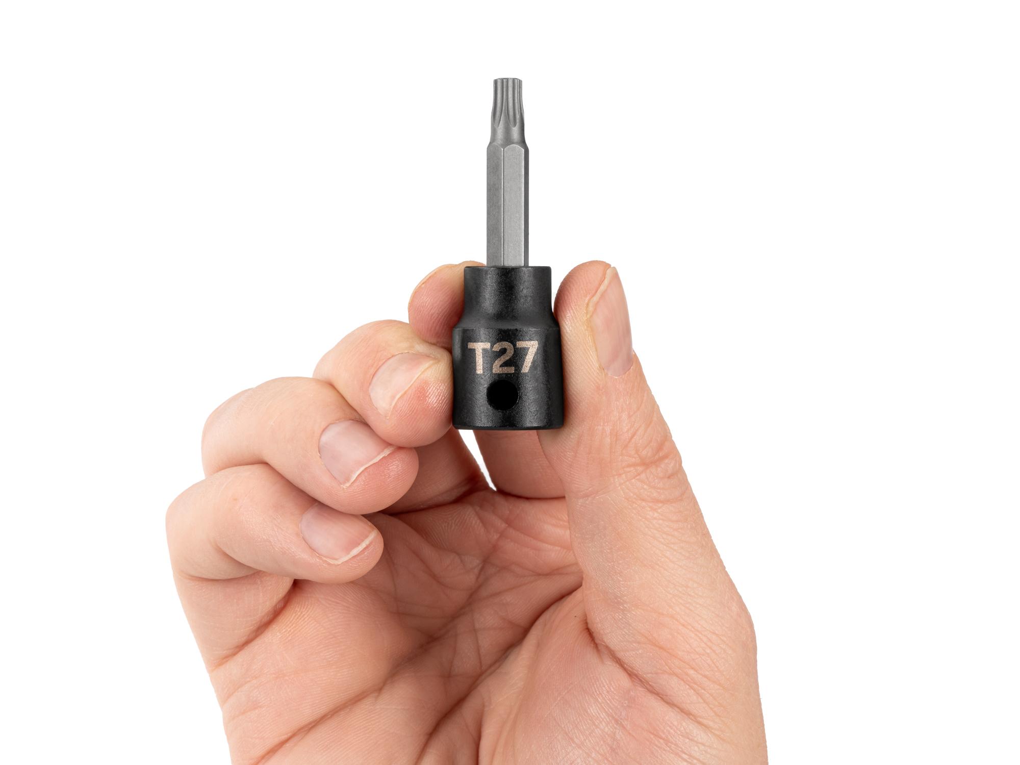 Person holding Tekton impact drive bit socket. Item #SIB14227