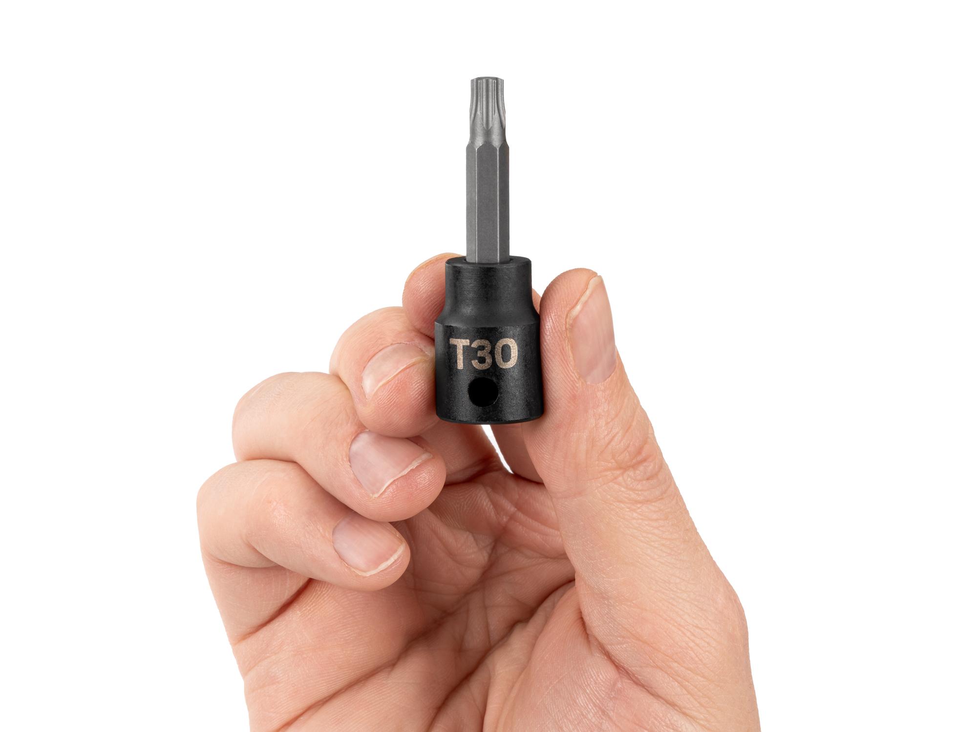 Person holding Tekton impact drive bit socket. Item #SIB14230