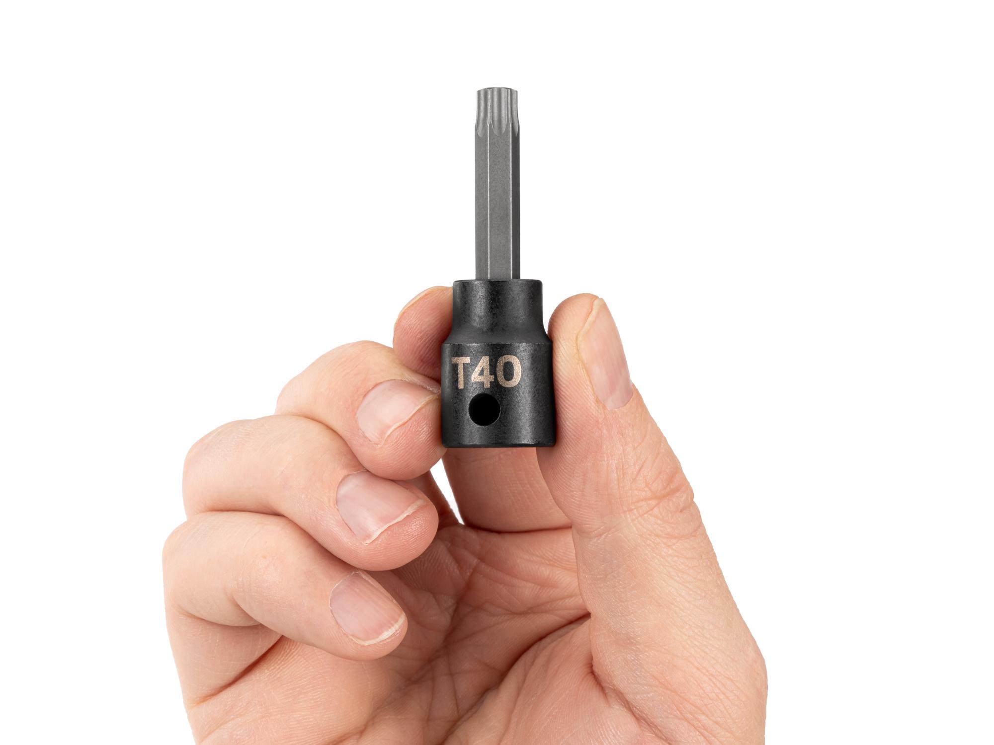Person holding Tekton impact drive bit socket. Item #SIB14240