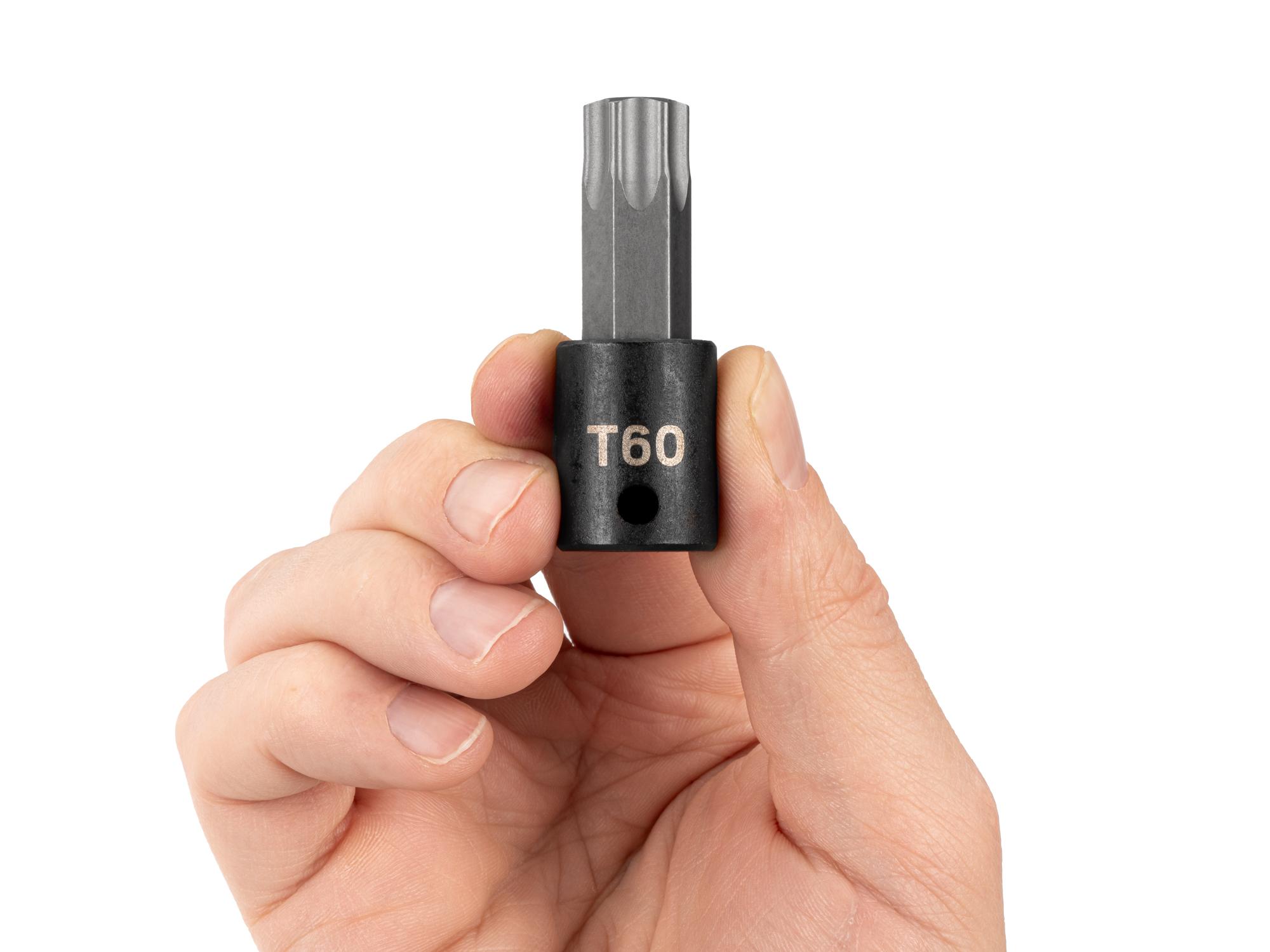 Person holding Tekton impact drive bit socket. Item #SIB14260
