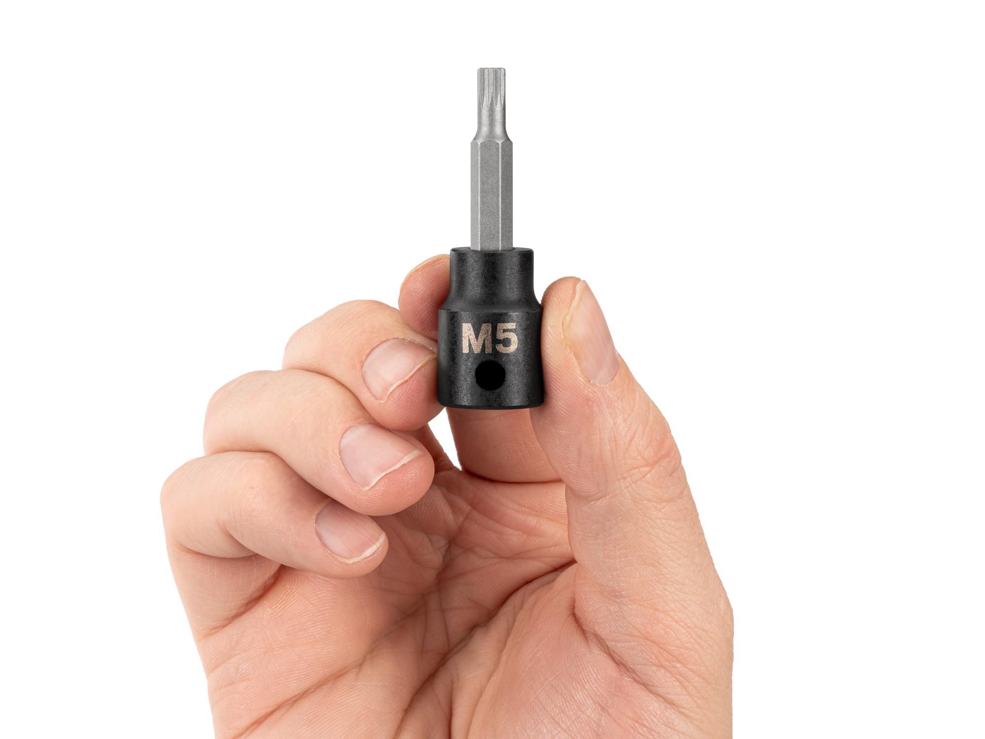Person holding Tekton impact drive bit socket. Item #SIB18205