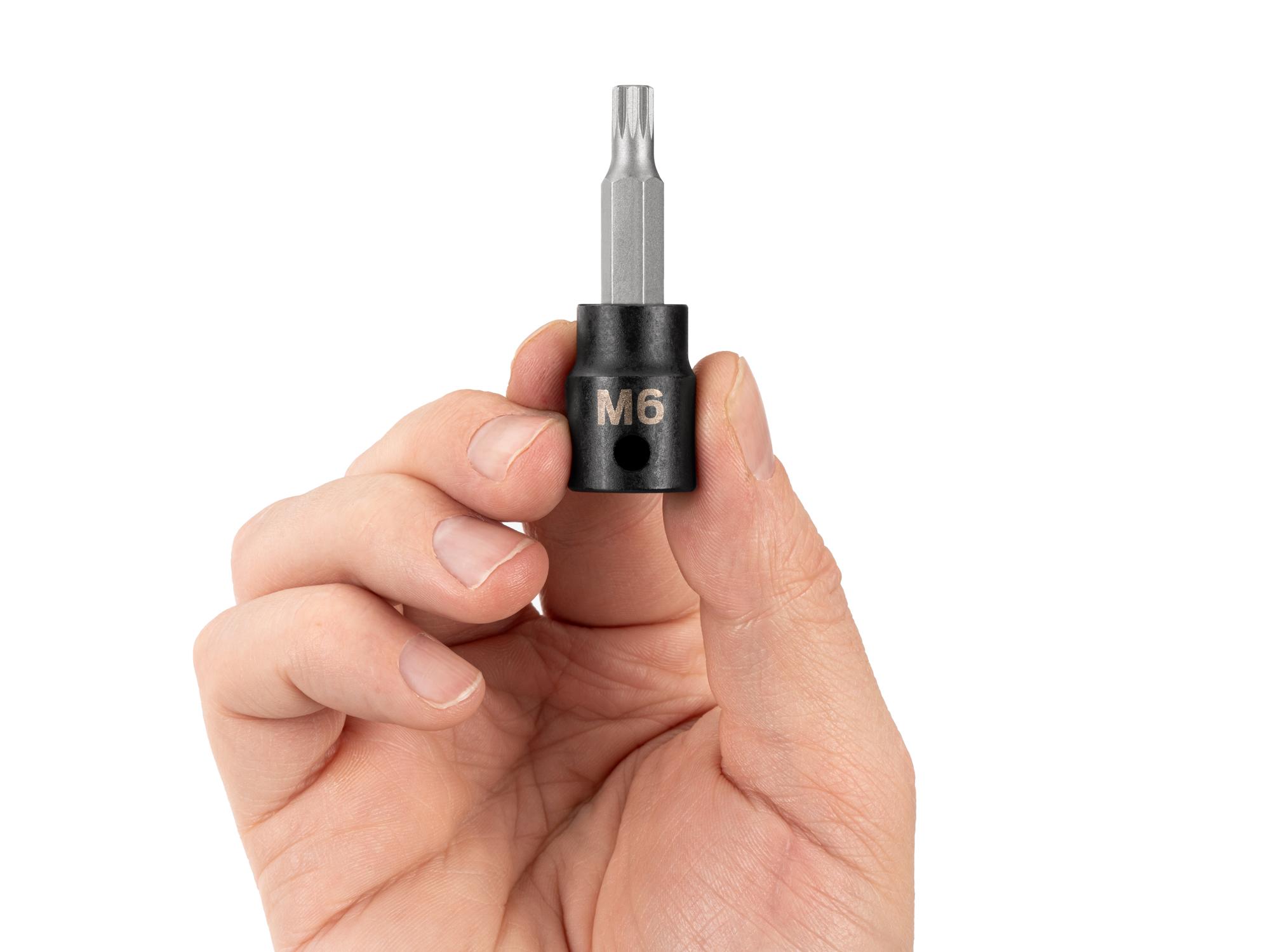 Person holding Tekton impact drive bit socket. Item #SIB18206