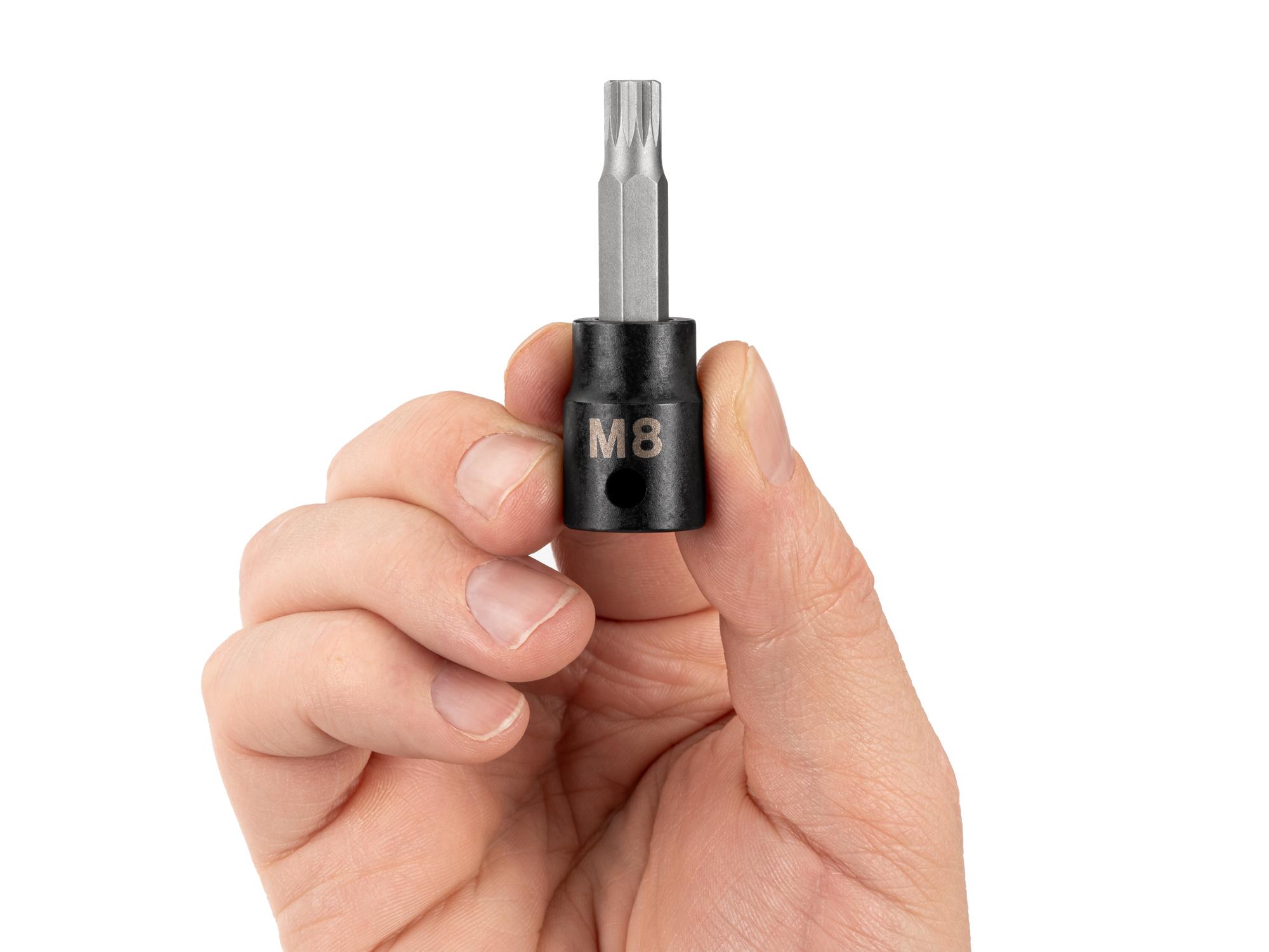 Person holding Tekton impact drive bit socket. Item #SIB18208