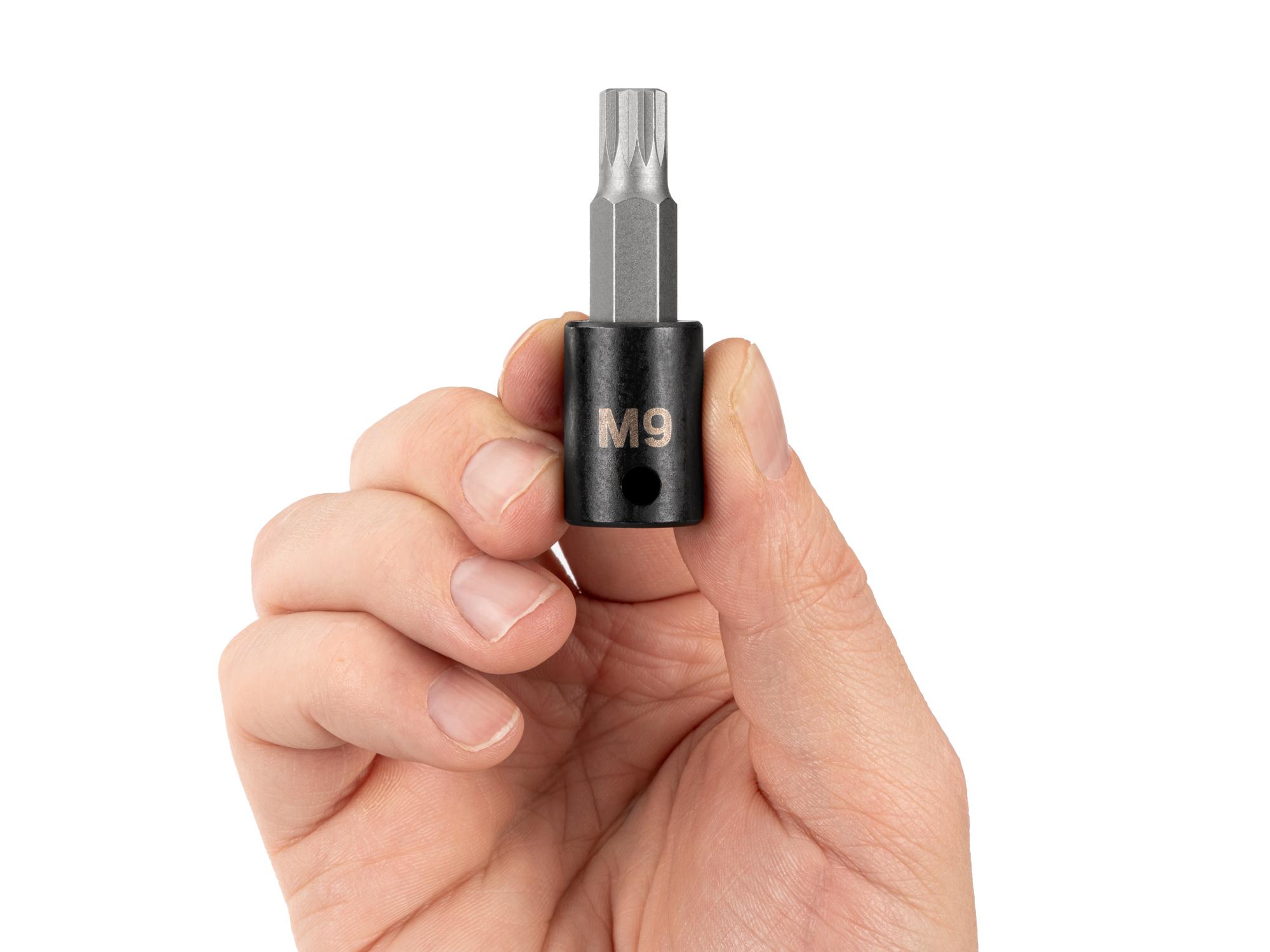 Person holding Tekton impact drive bit socket. Item #SIB18209