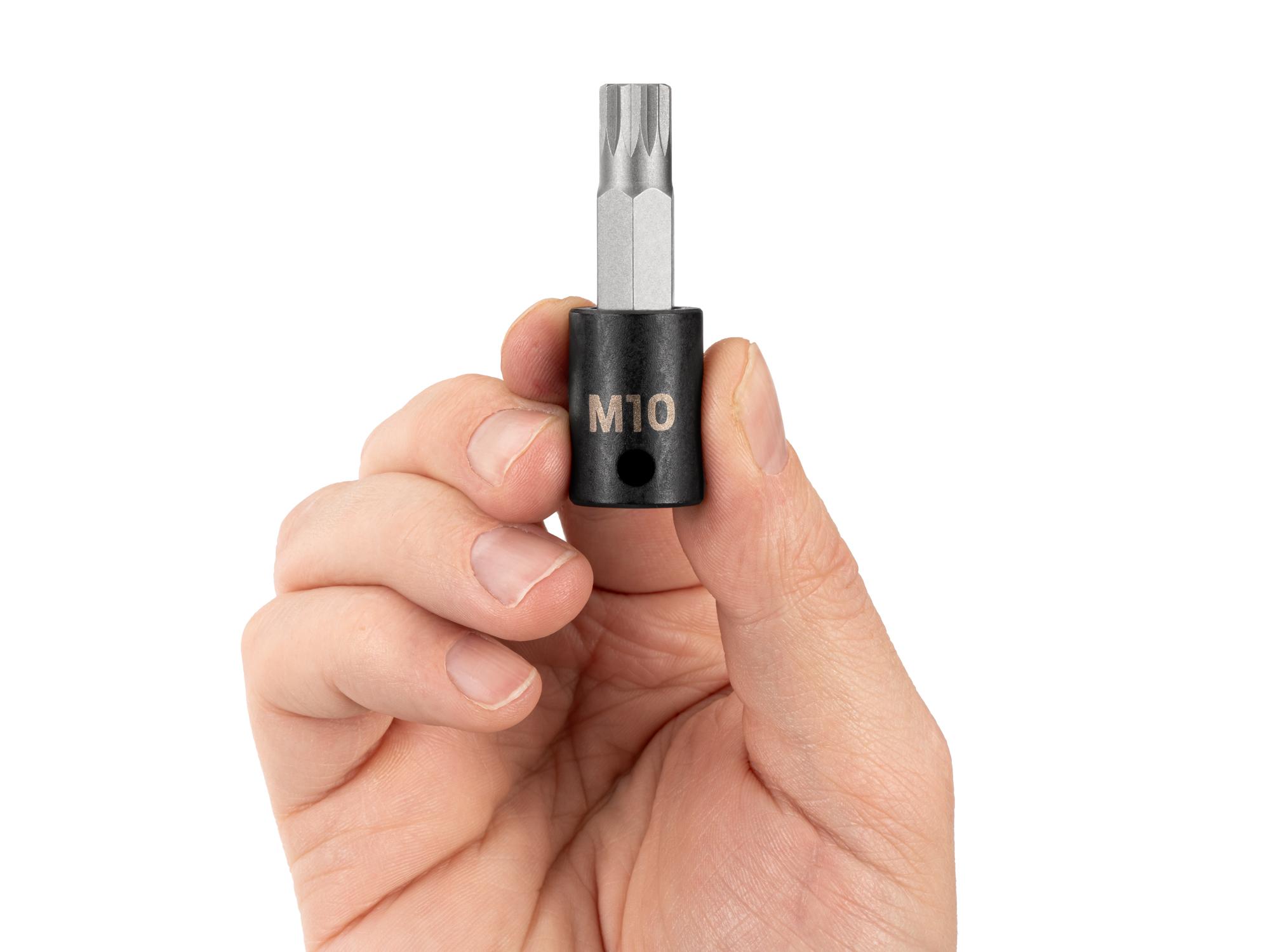 Person holding Tekton impact drive bit socket. Item #SIB18210