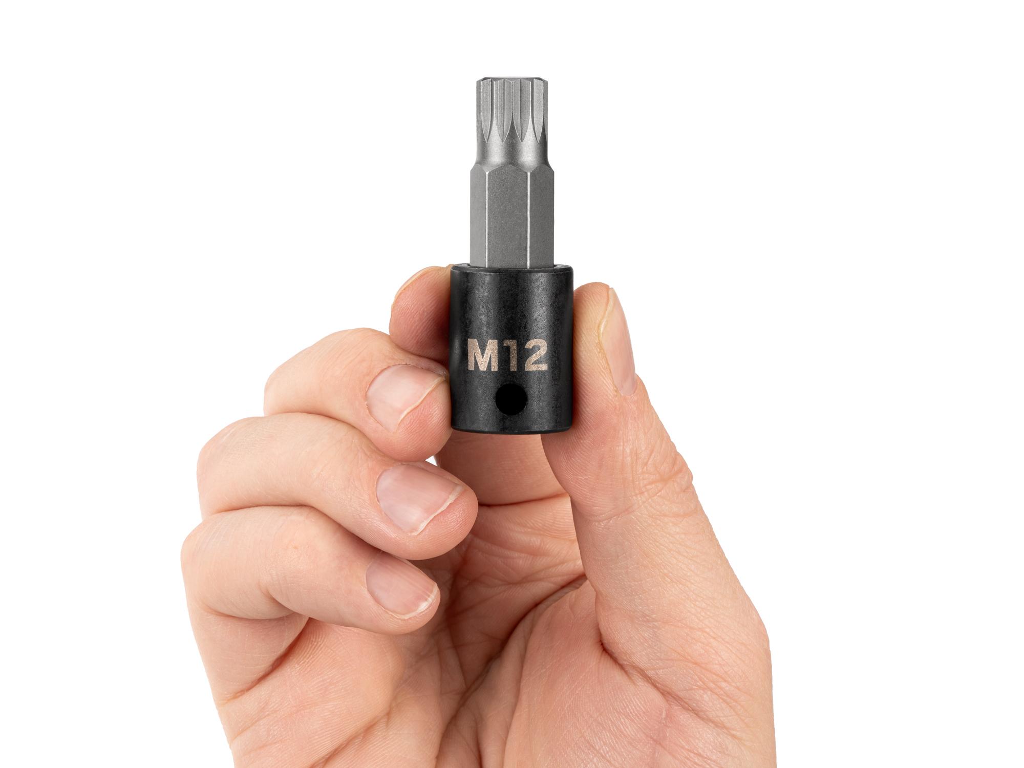 Person holding Tekton impact drive bit socket. Item #SIB18212