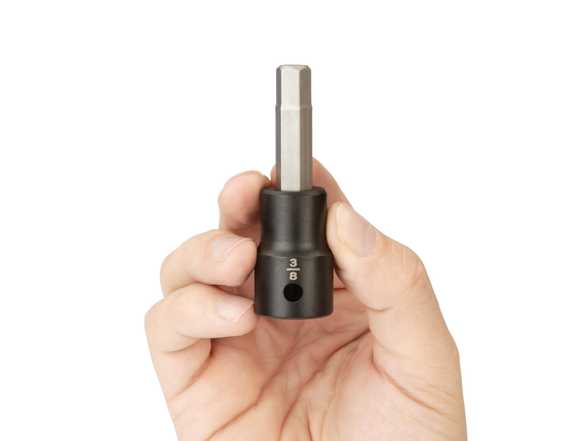 Person holding Tekton impact drive bit socket. Item #SIB22210