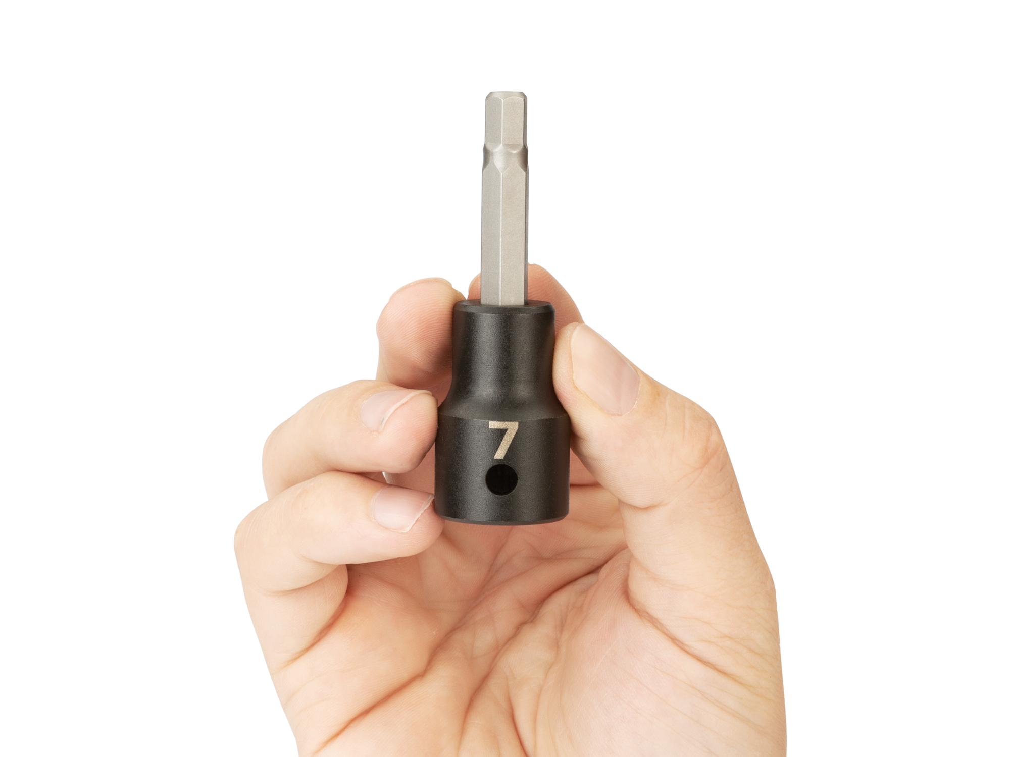 Person holding Tekton impact drive bit socket. Item #SIB23207