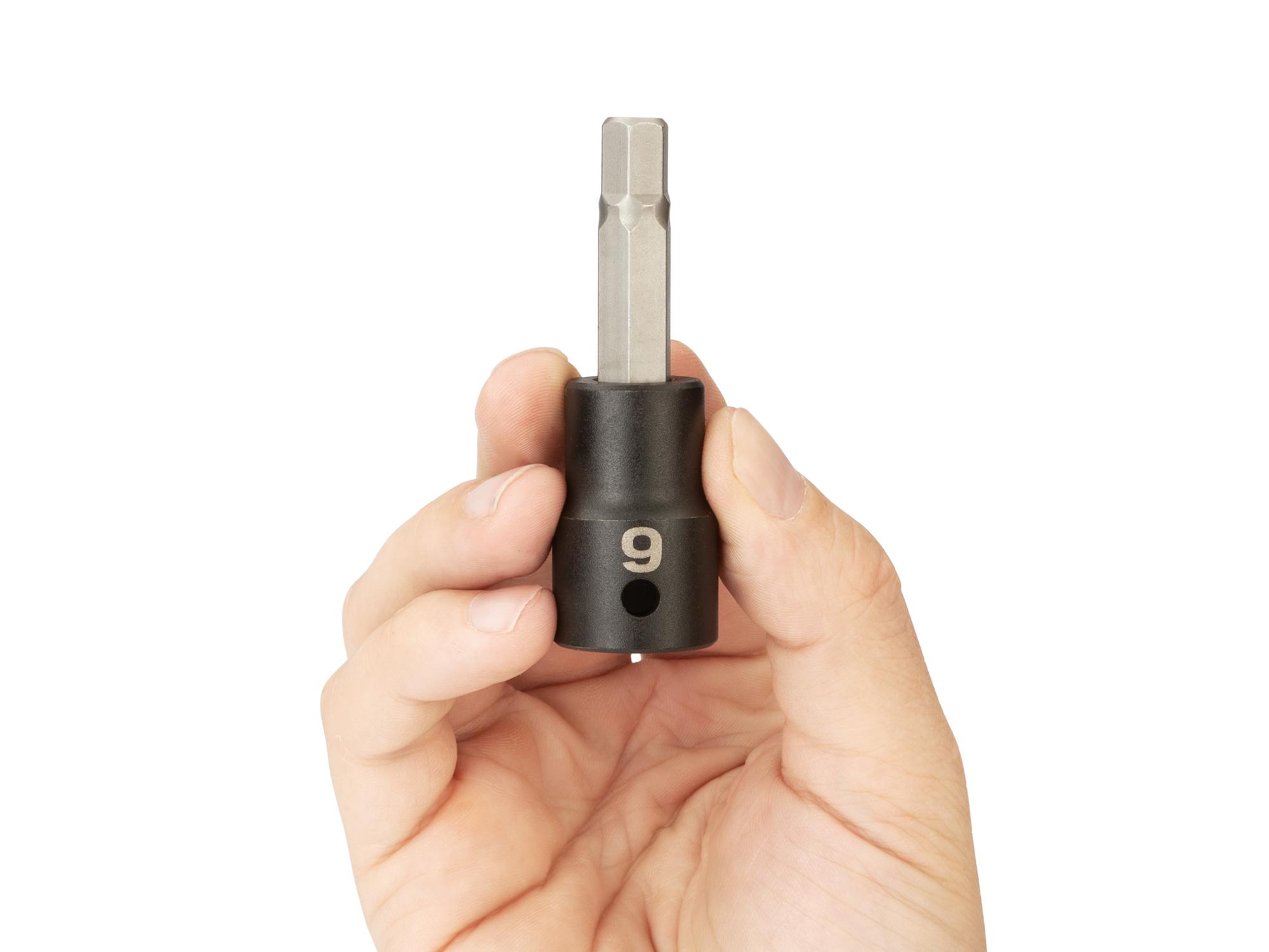 Person holding Tekton impact drive bit socket. Item #SIB23209