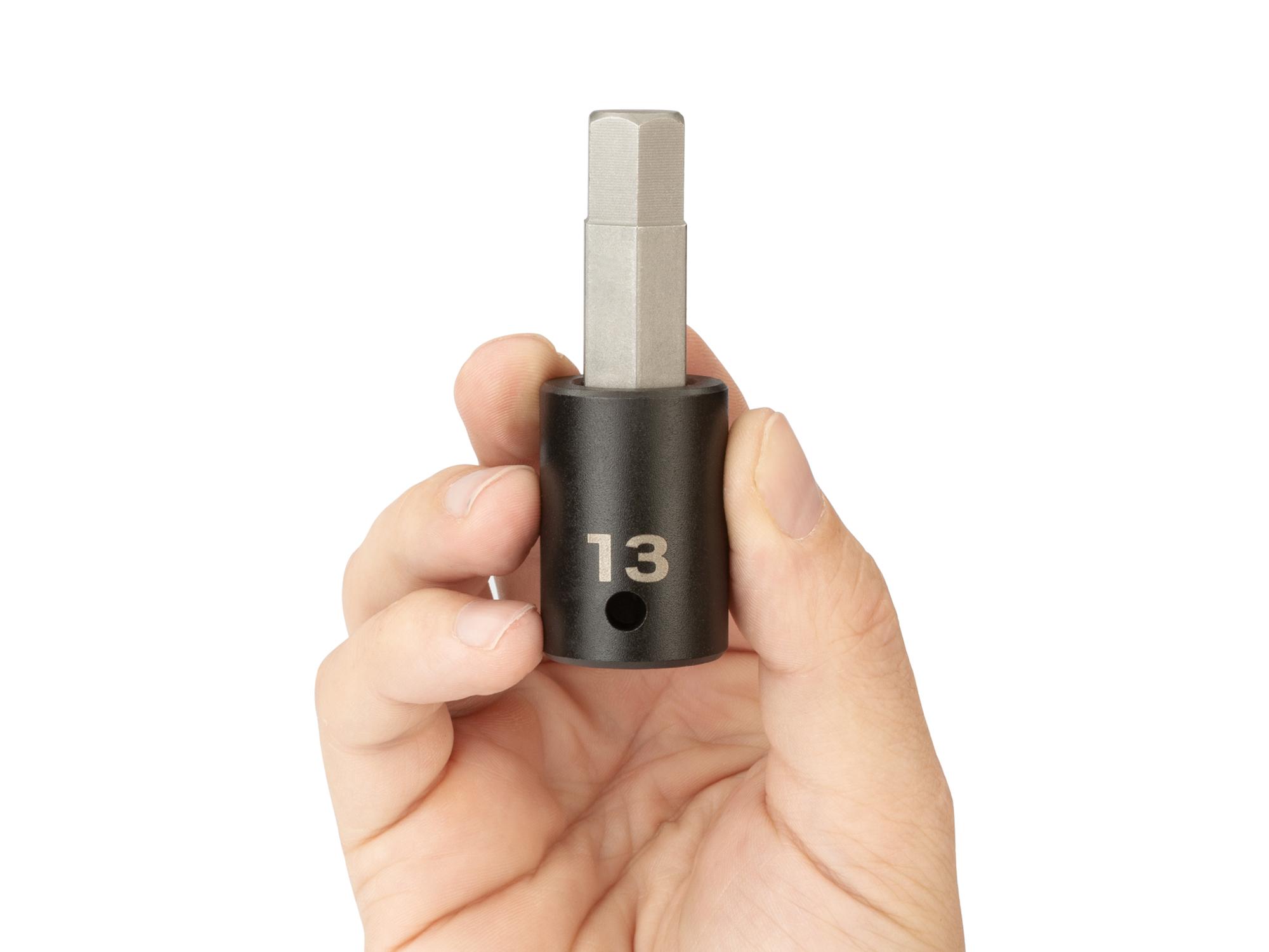 Person holding Tekton impact drive bit socket. Item #SIB23213