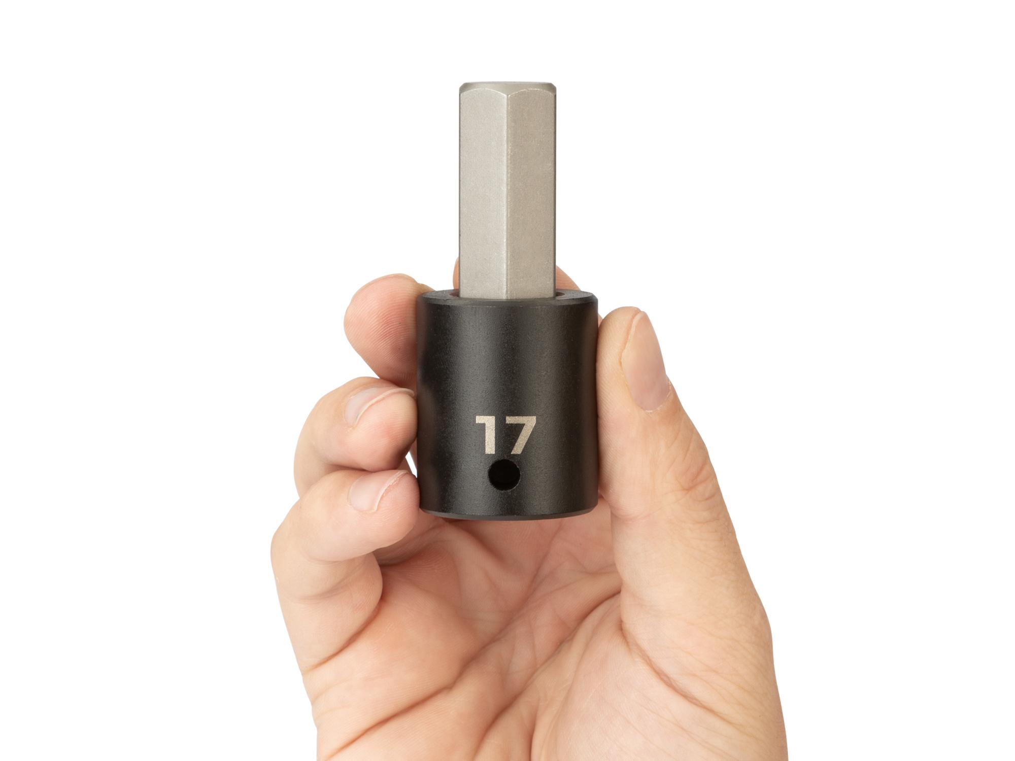 Person holding Tekton impact drive bit socket. Item #SIB23217