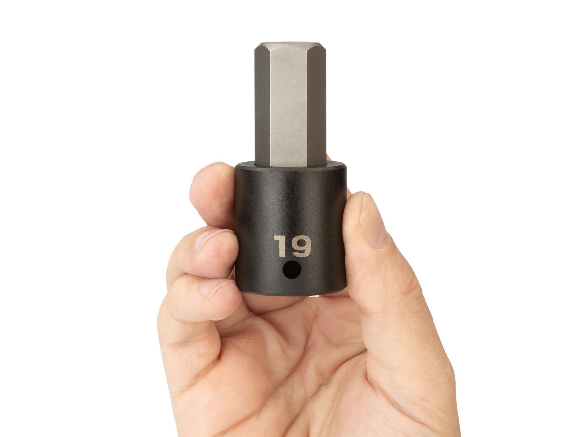 Person holding Tekton impact drive bit socket. Item #SIB23219