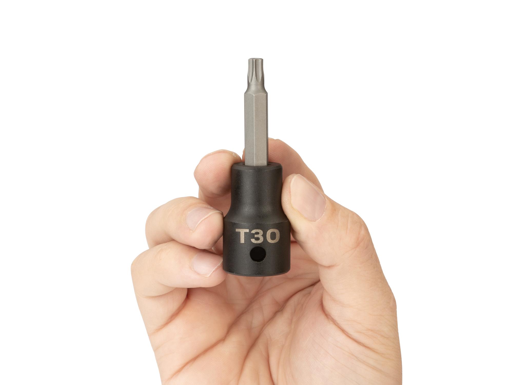 Person holding Tekton impact drive bit socket. Item #SIB24230