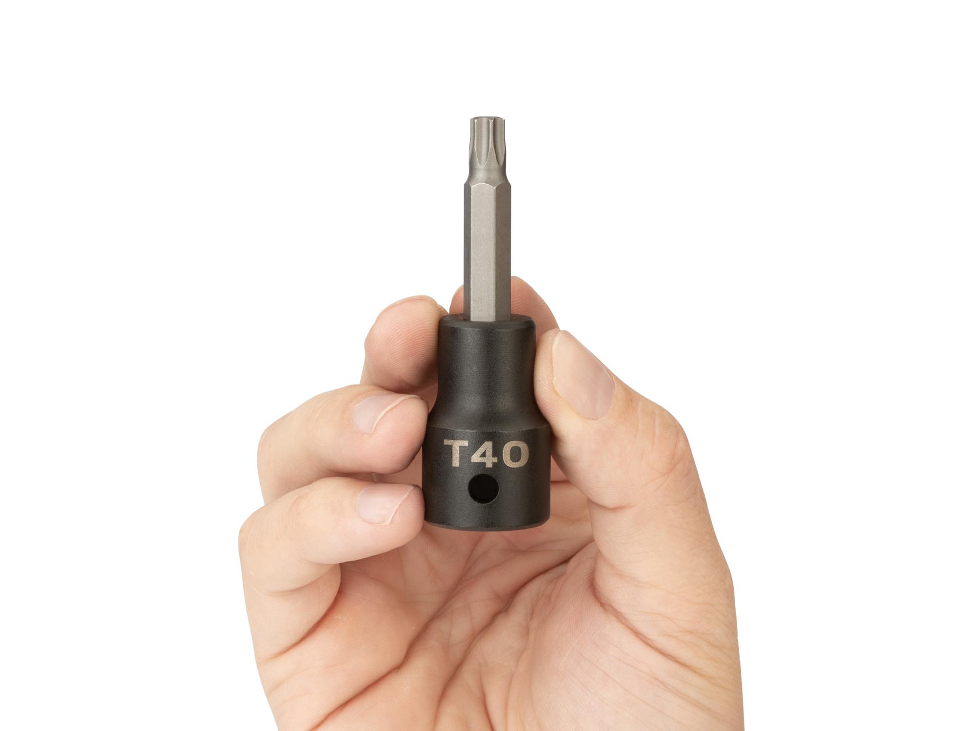Person holding Tekton impact drive bit socket. Item #SIB24240