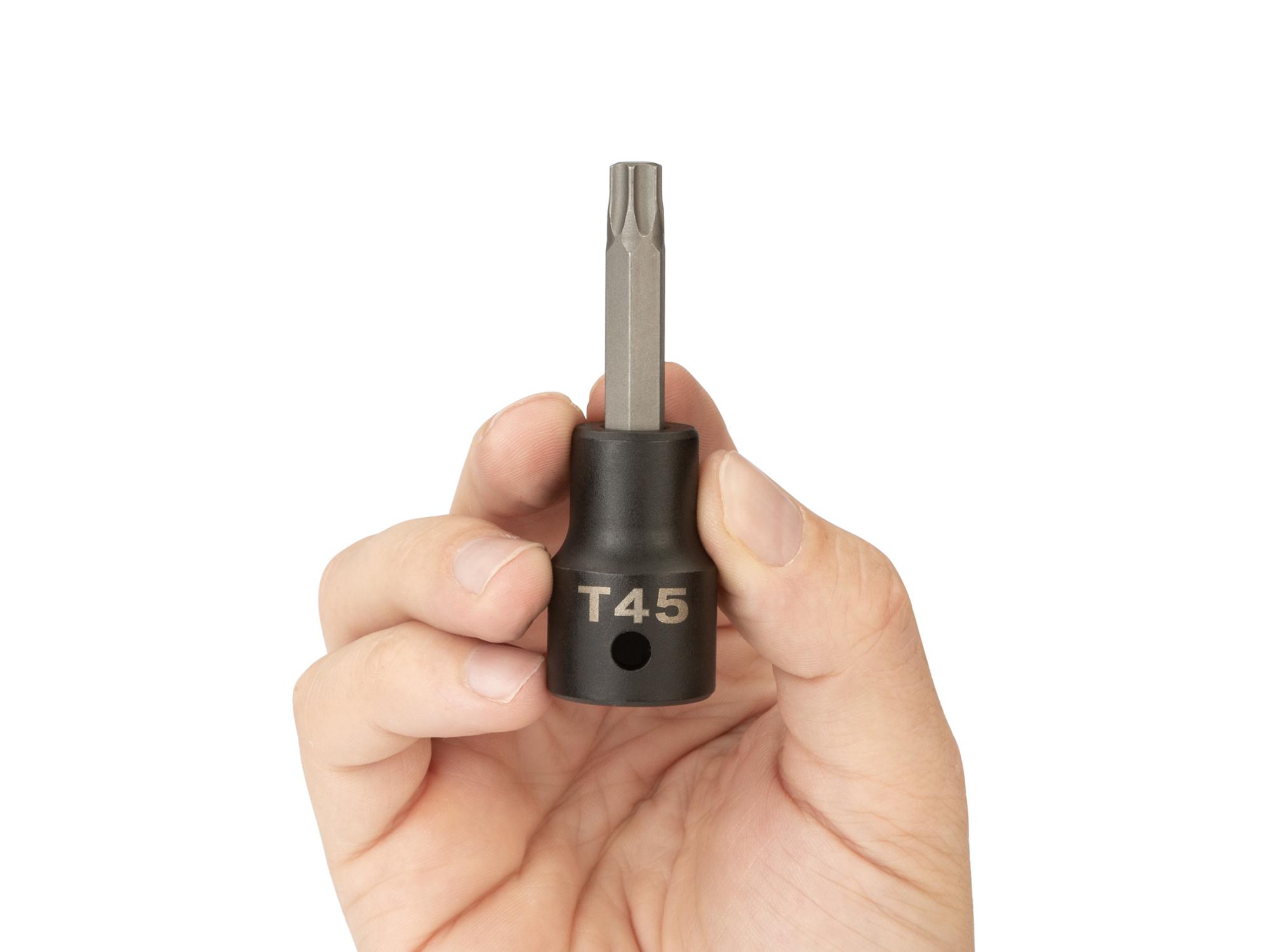 Person holding Tekton impact drive bit socket. Item #SIB24245