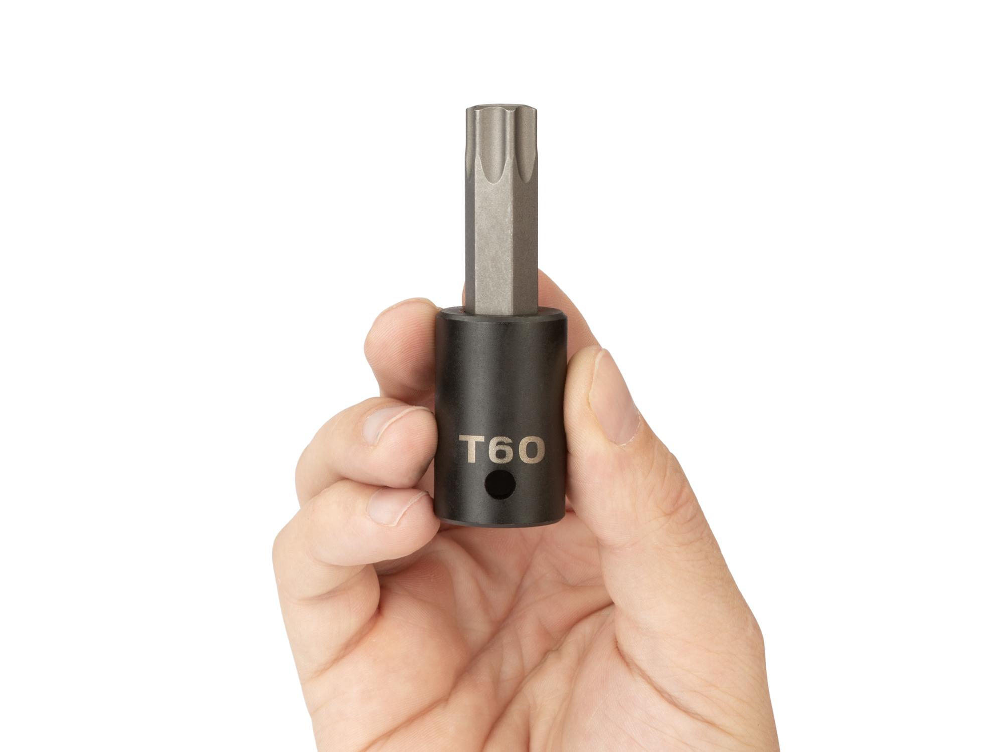 Person holding Tekton impact drive bit socket. Item #SIB24260
