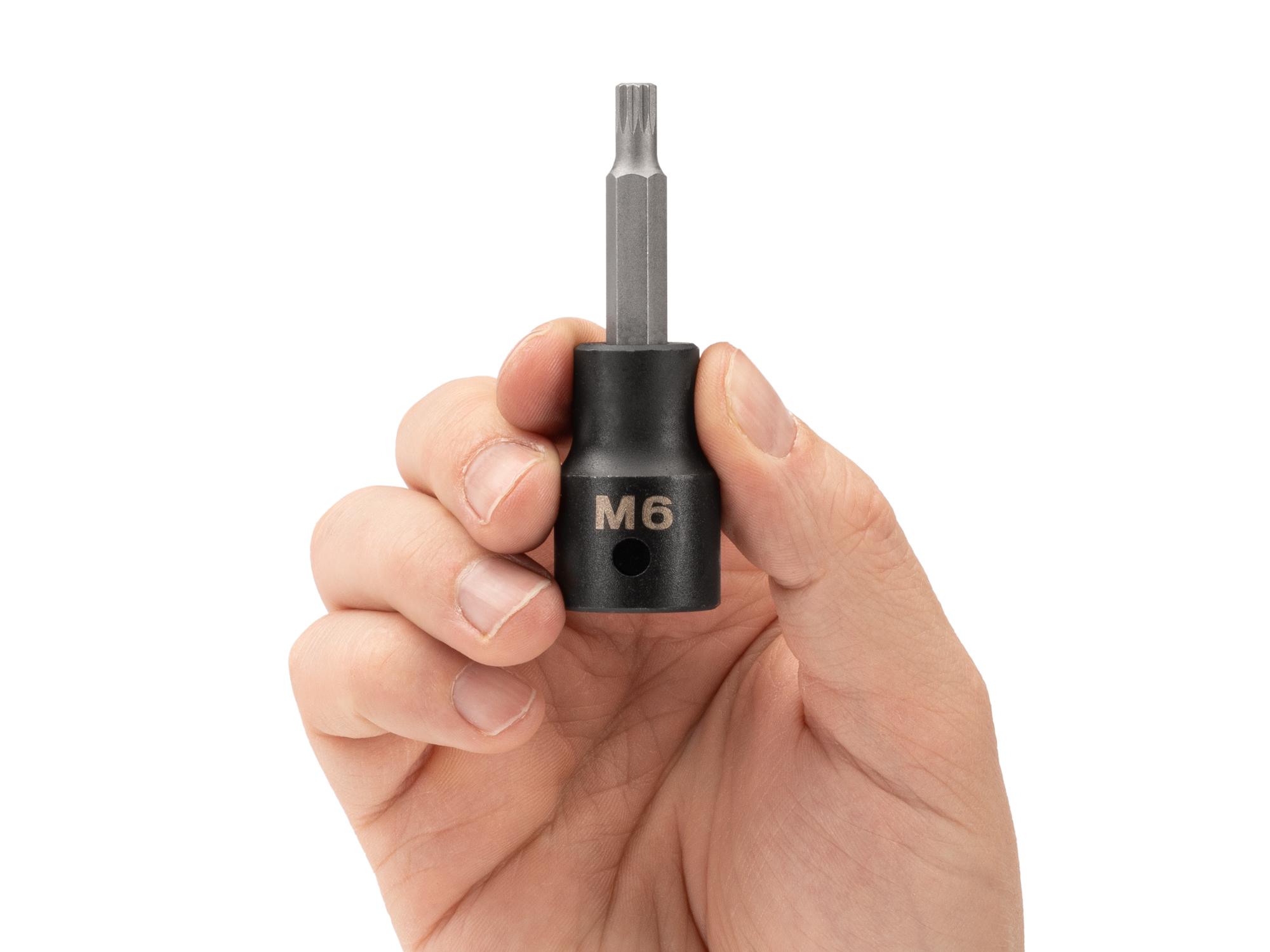 Person holding Tekton impact drive bit socket. Item #SIB28206