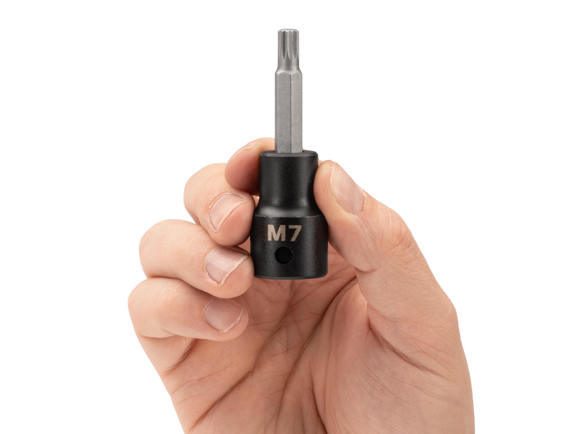 Person holding Tekton impact drive bit socket. Item #SIB28207